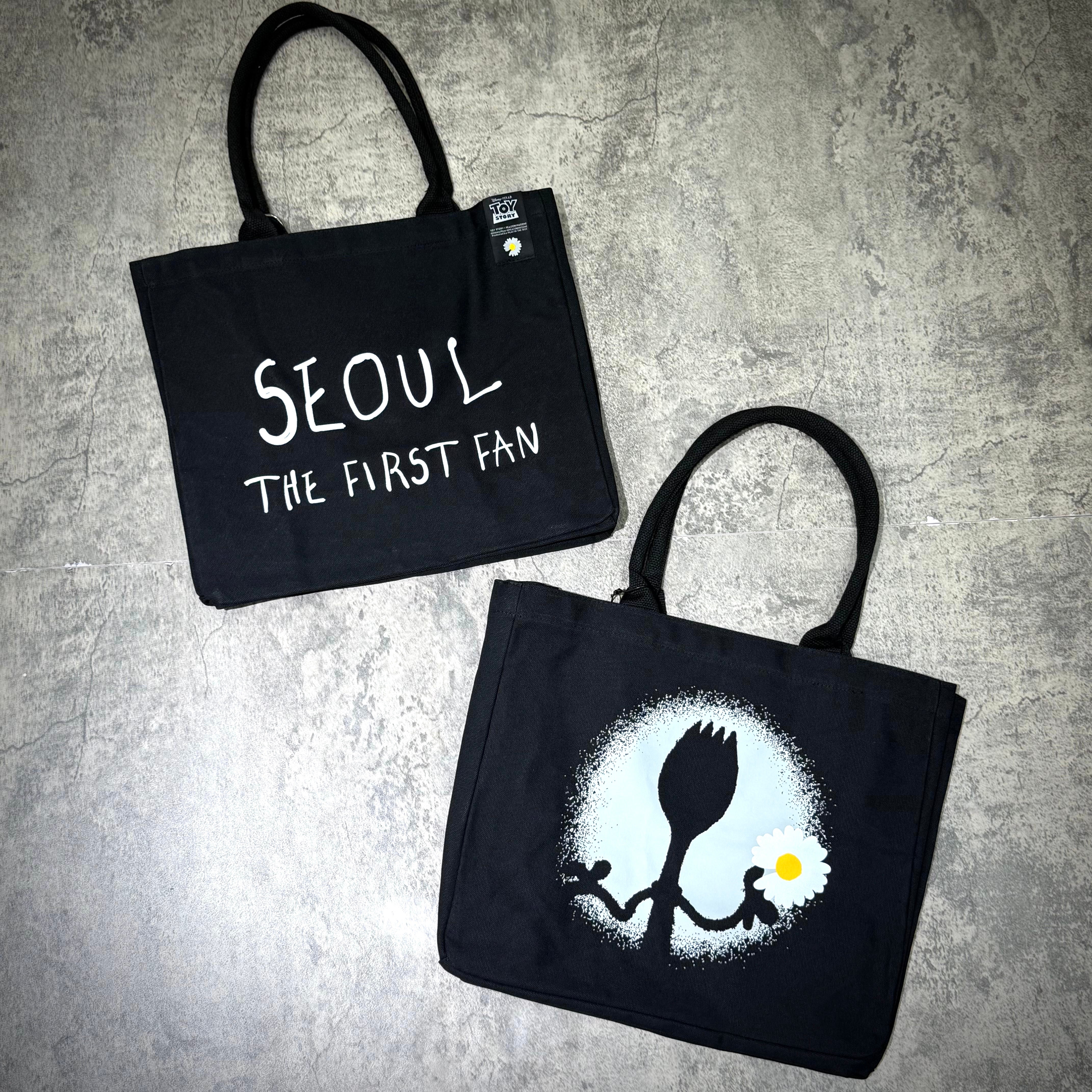PEACEMINUSONE x Toy Story The First Fan - Tote Bag featuring designs including 'Seoul The First Fan' and a unique fork illustration.