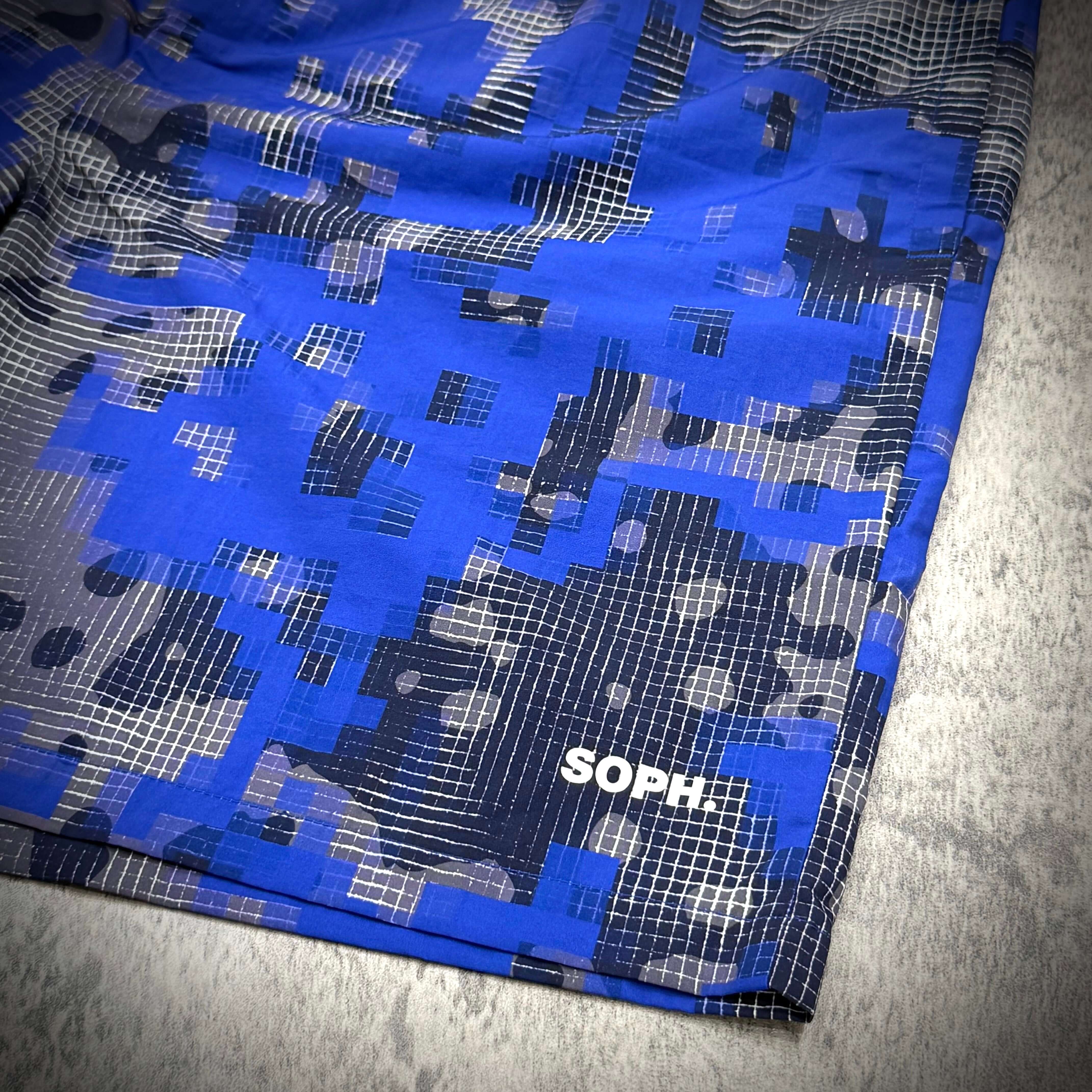 Fragment x FCRB Camouflage Nylon Shorts featuring a blue camouflage pattern and SOPH logo detail.