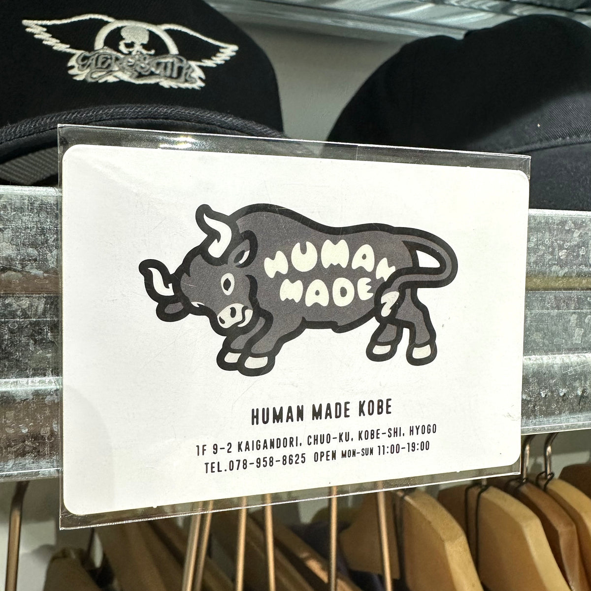 Image of a Human Made Store Exclusive Fridge Magnet featuring a playful bull design and store details at KOBE store