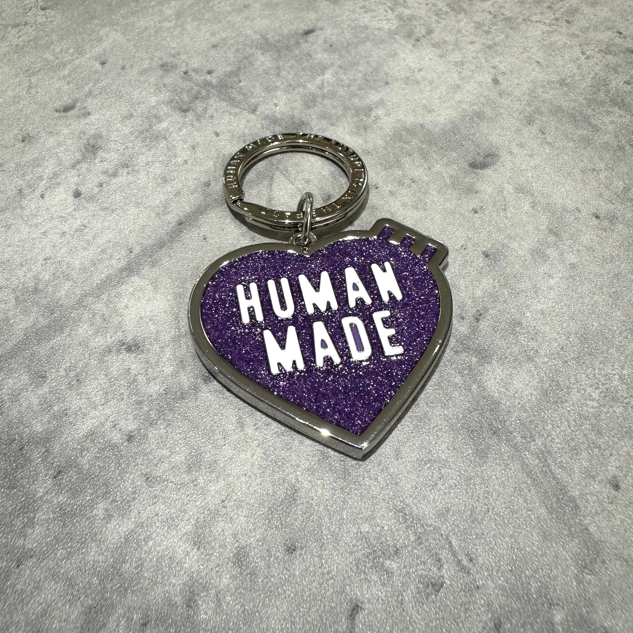 Human Made Store Exclusive Heart Keychain in purple glitter design on a gray background.