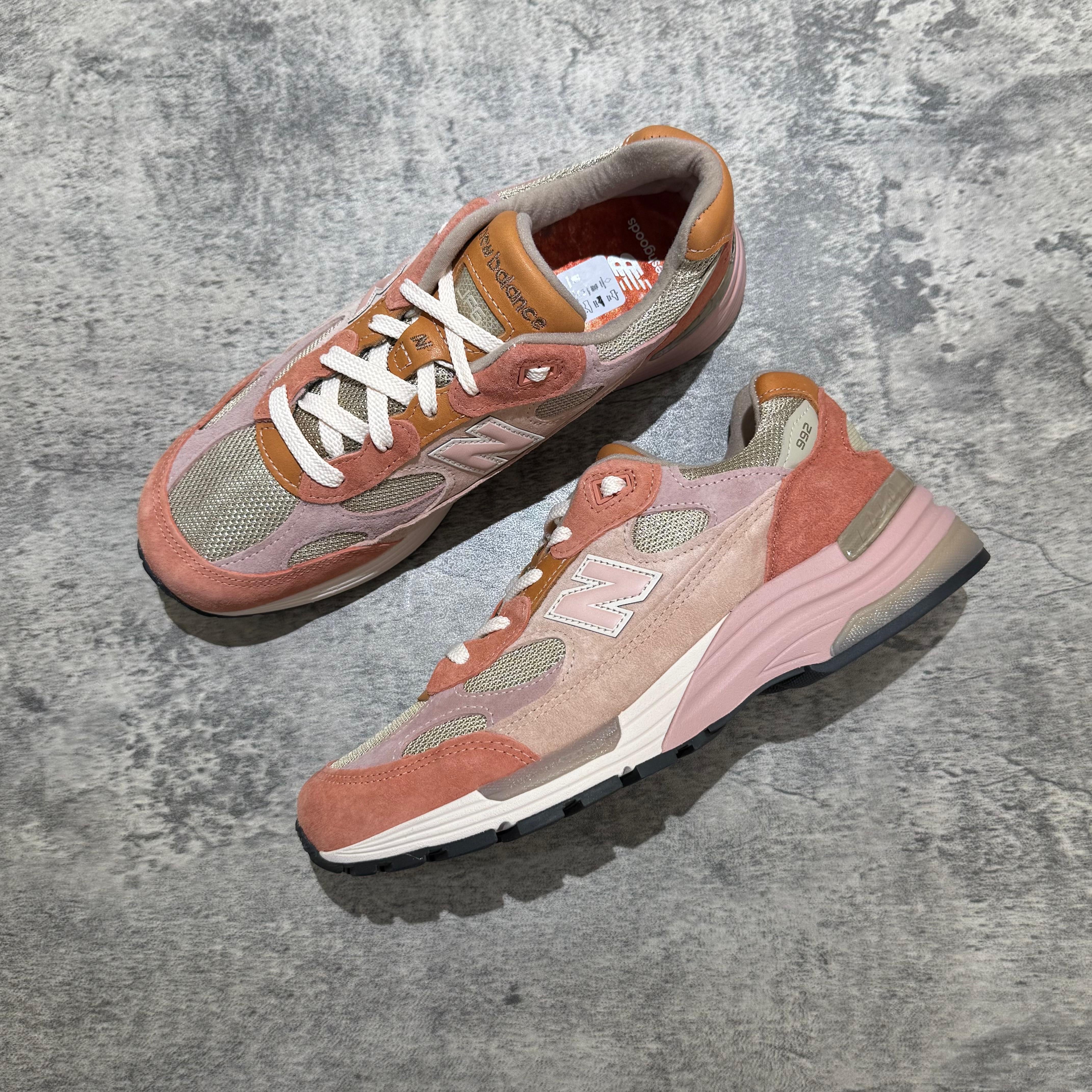 Joe Freshgoods x New Balance Made in USA 992 sneakers in pink and beige colorway on textured surface.