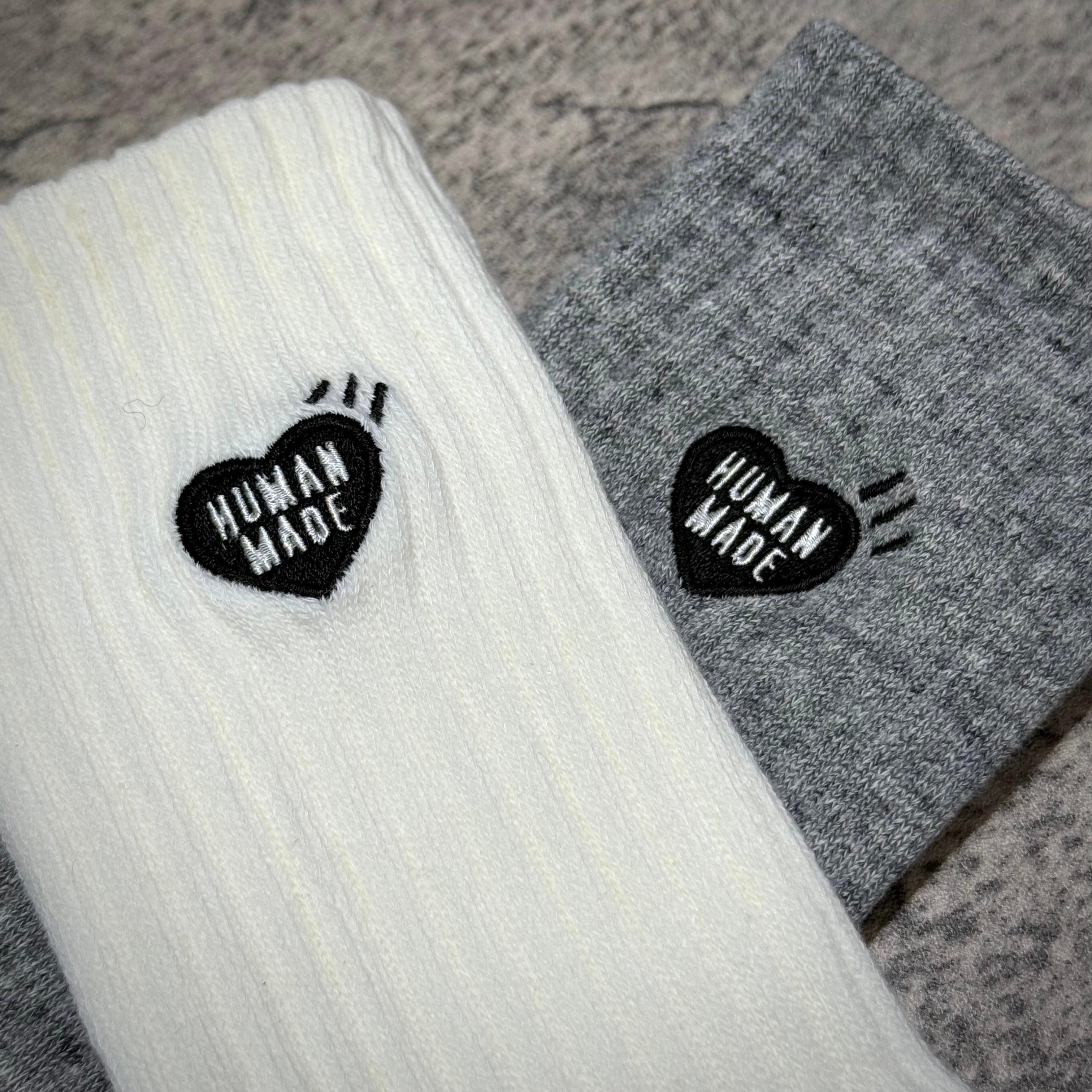 Human Made Pile Socks featuring a ribbed design in white and grey with heart logo detailing.