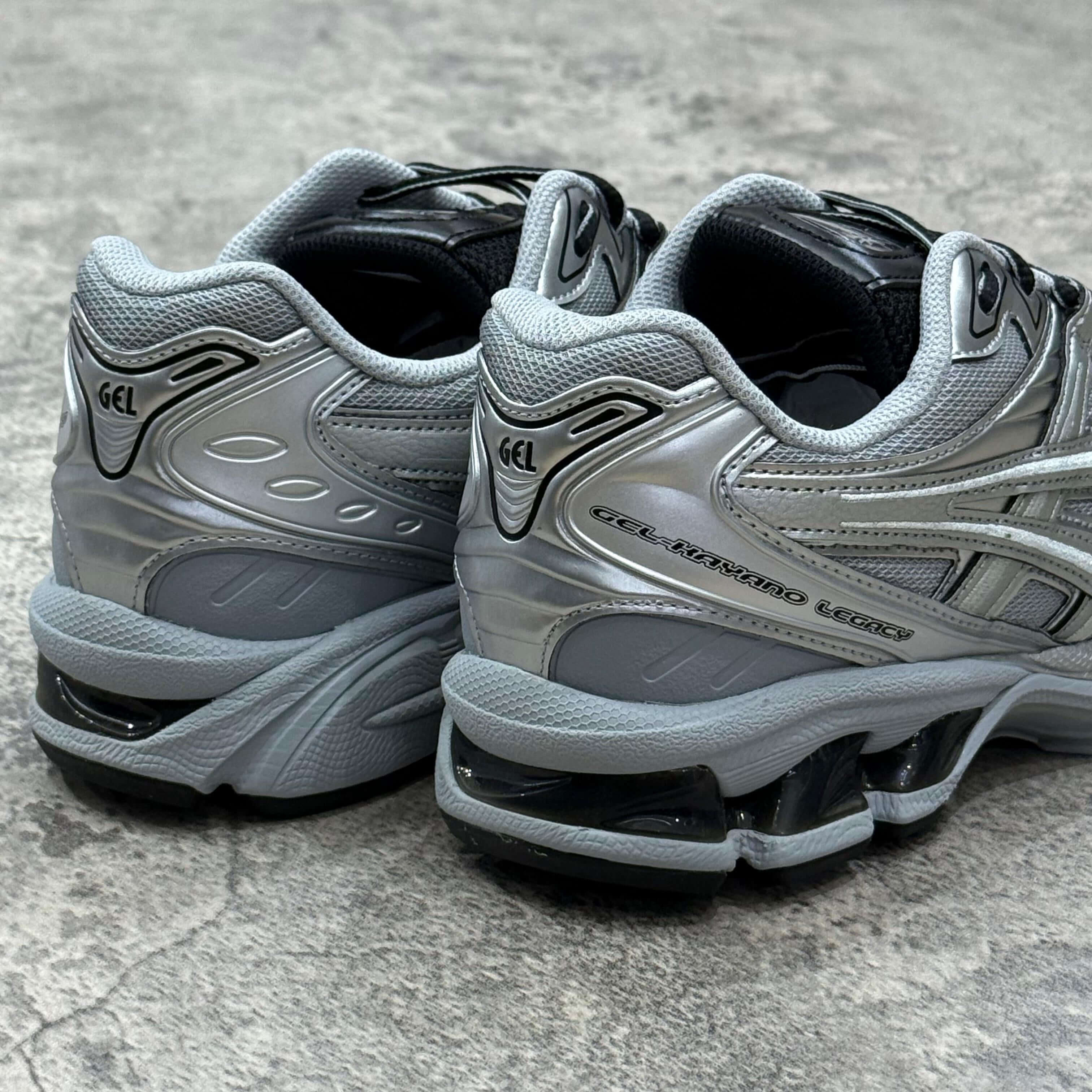 Asics Gel Kayano Legacy Pure Silver sneaker rear view showcasing sleek design and cushioning technology.