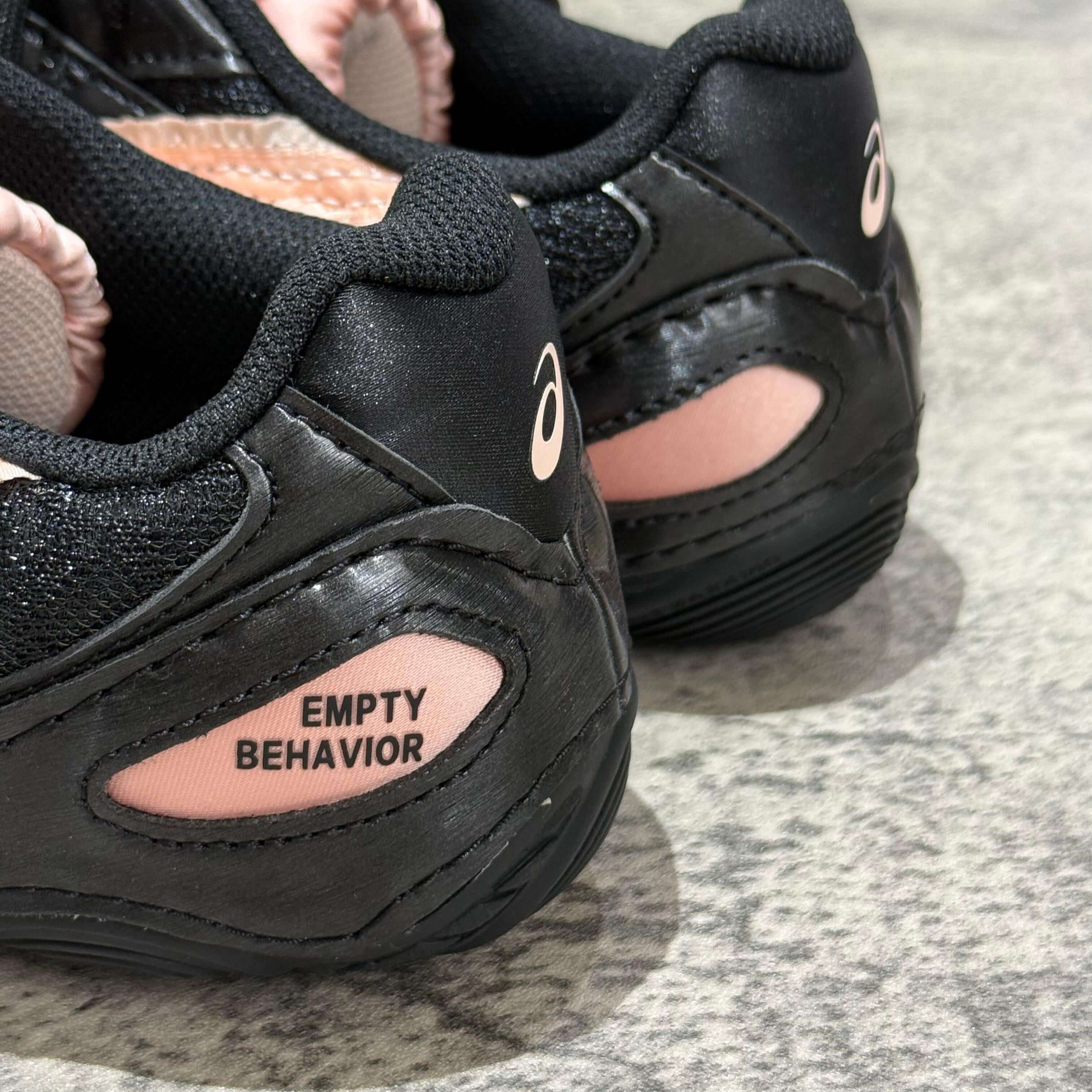 Asics x Empty Behavior Hypersync shoe detail showing black and pink design with EMPTY BEHAVIOR branding.