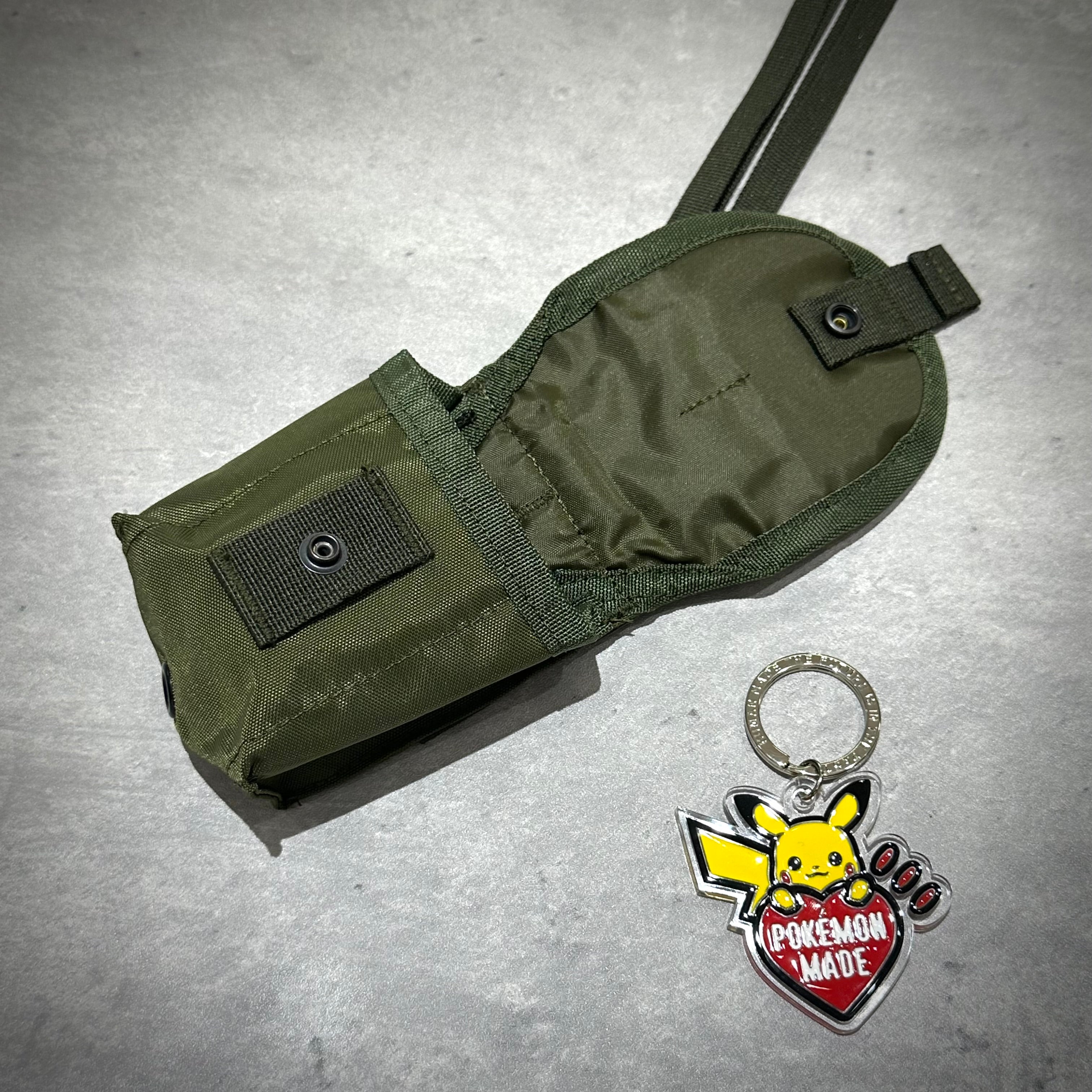 Human Made Military Multi Pouch Mini HM32GD010 in olive green with Pokémon Made keychain.