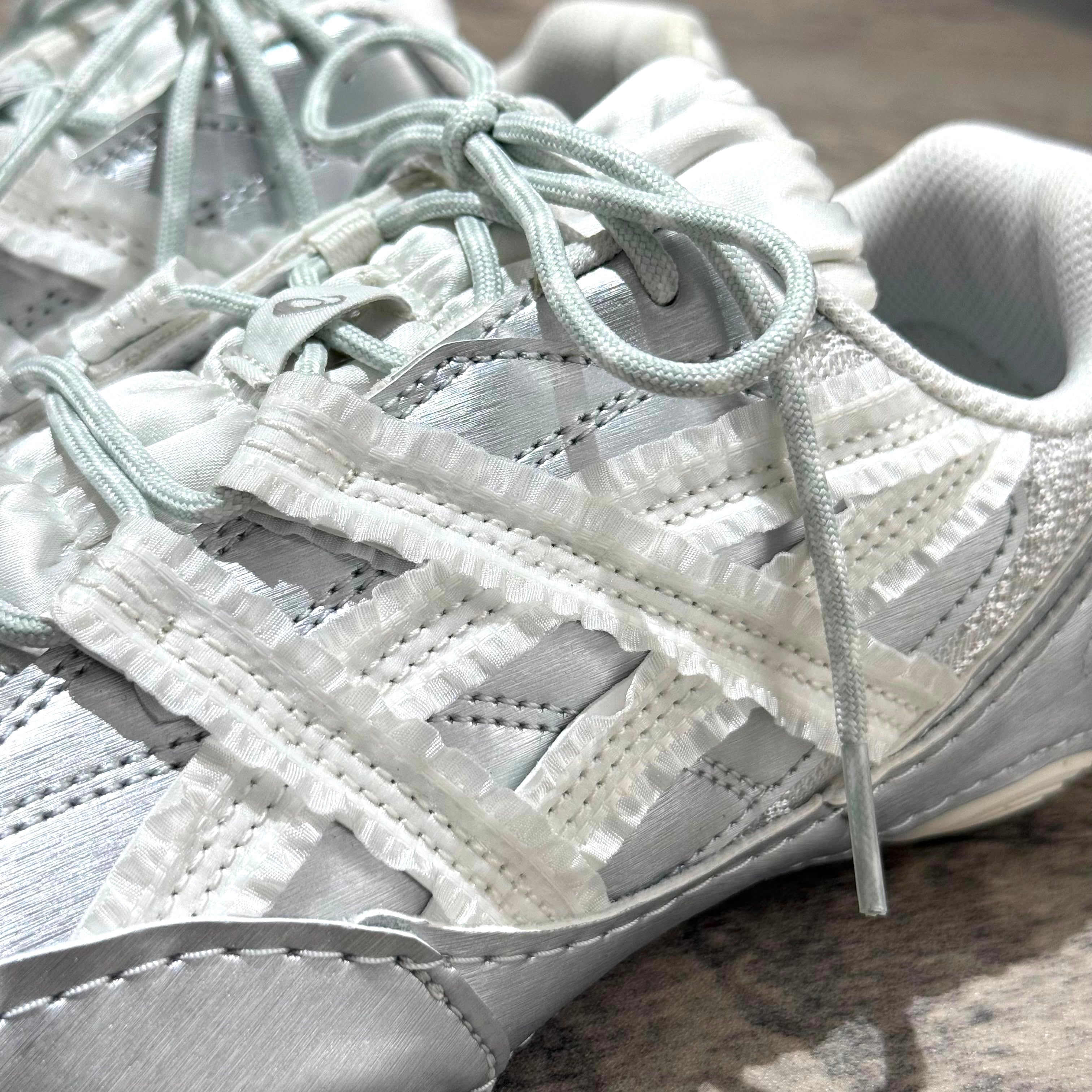 Asics x Empty Behavior Hypersync in Pure Silver White with intricate lacing detail and sleek design.