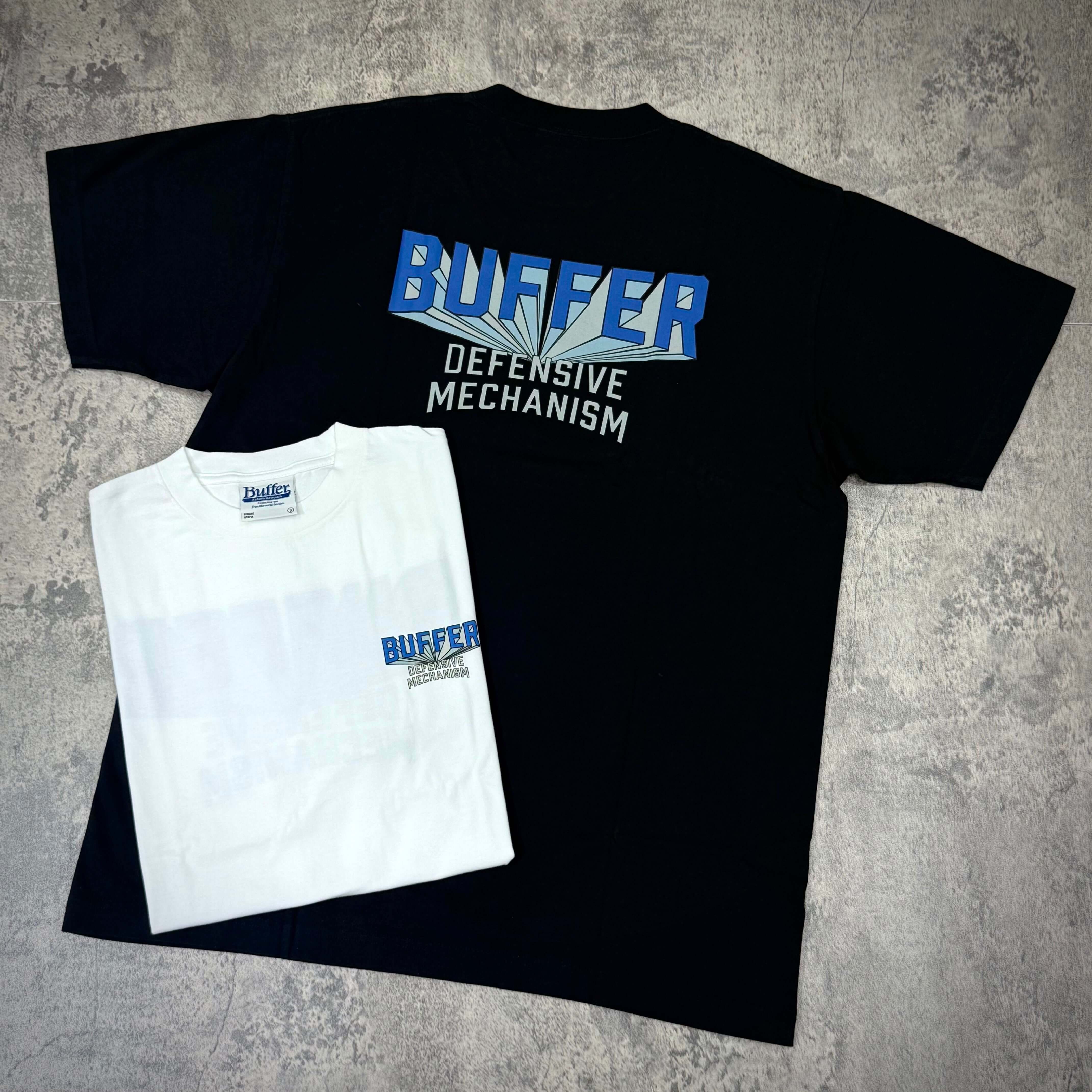 Buffer Gravity Tee - Black / White, featuring bold graphics and front logo, showcasing brand's unique design.