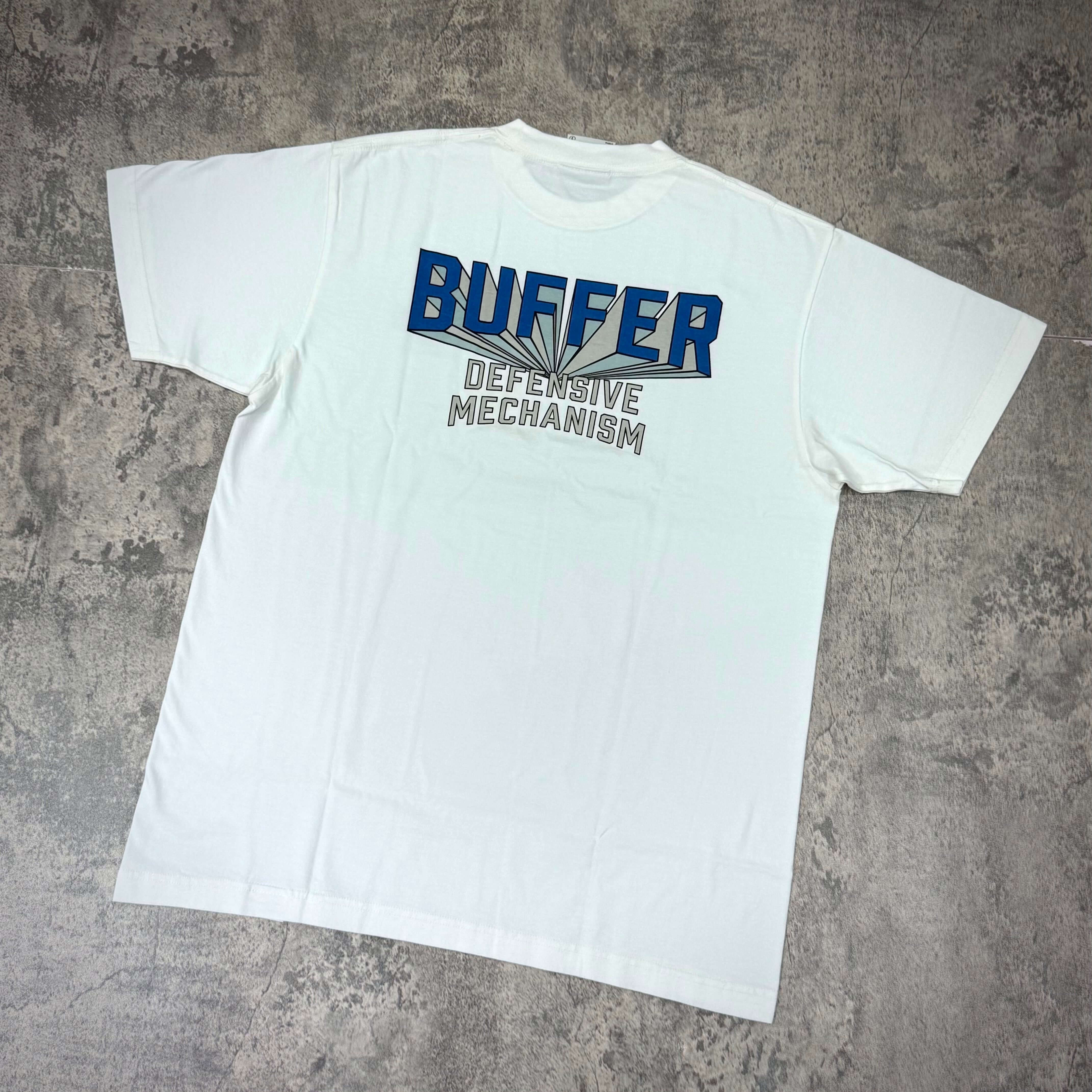 Buffer Gravity Tee - Black / White with 'BUFFER DEFENSIVE MECHANISM' printed on back.