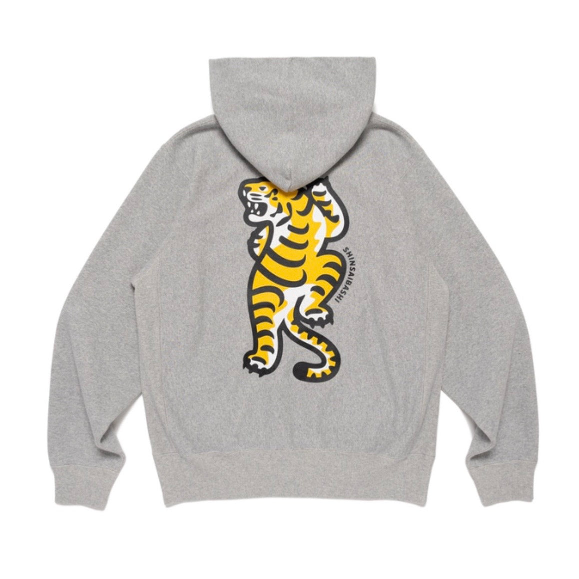 Human Made Shinsaibashi Exclusive Tiger Heavyweight Hoodie featuring a vibrant tiger graphic on a gray background.