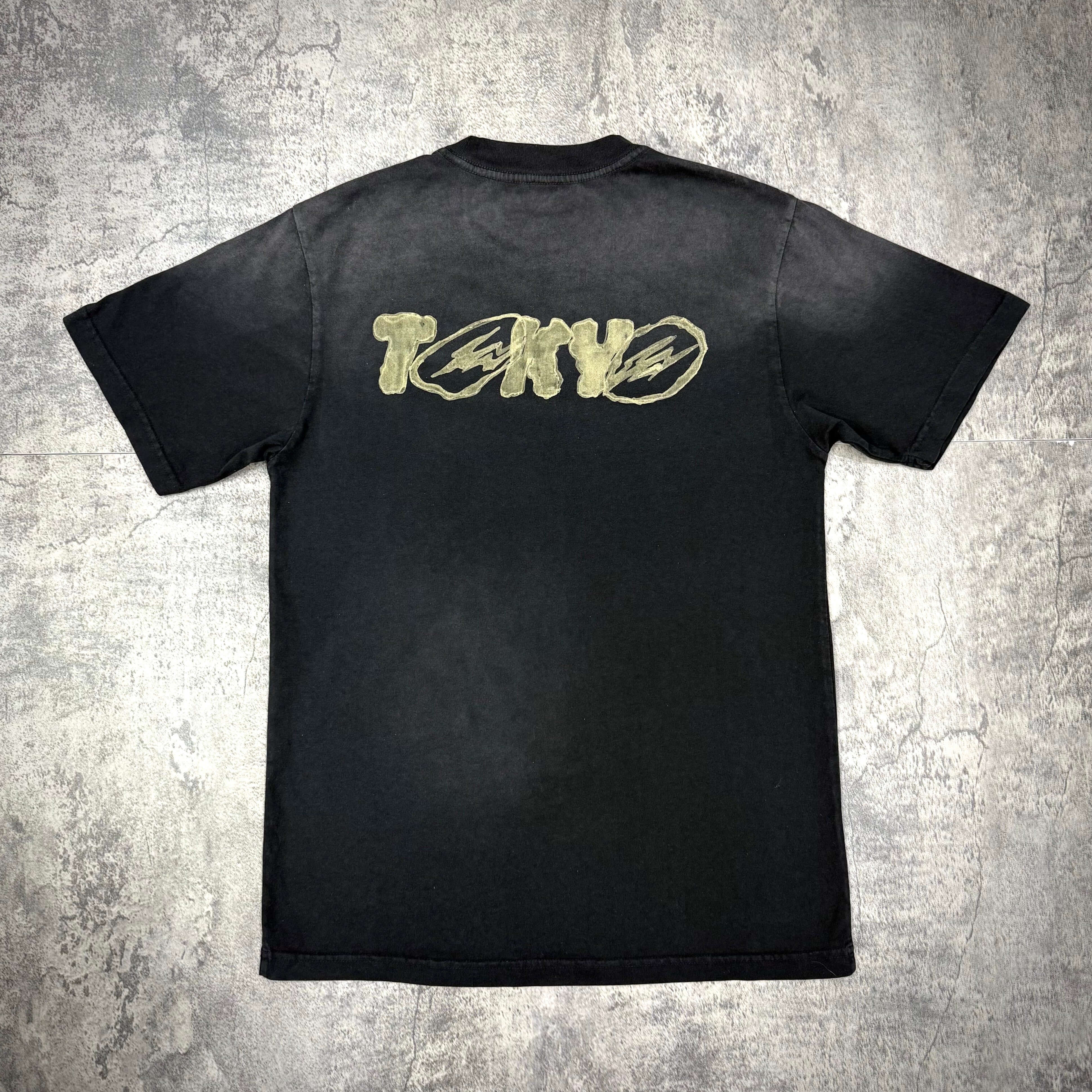 Cactus Jack x Fragment x Takashi Murakami Tokyo Jack Tee back design featuring unique graphic in black and gold.