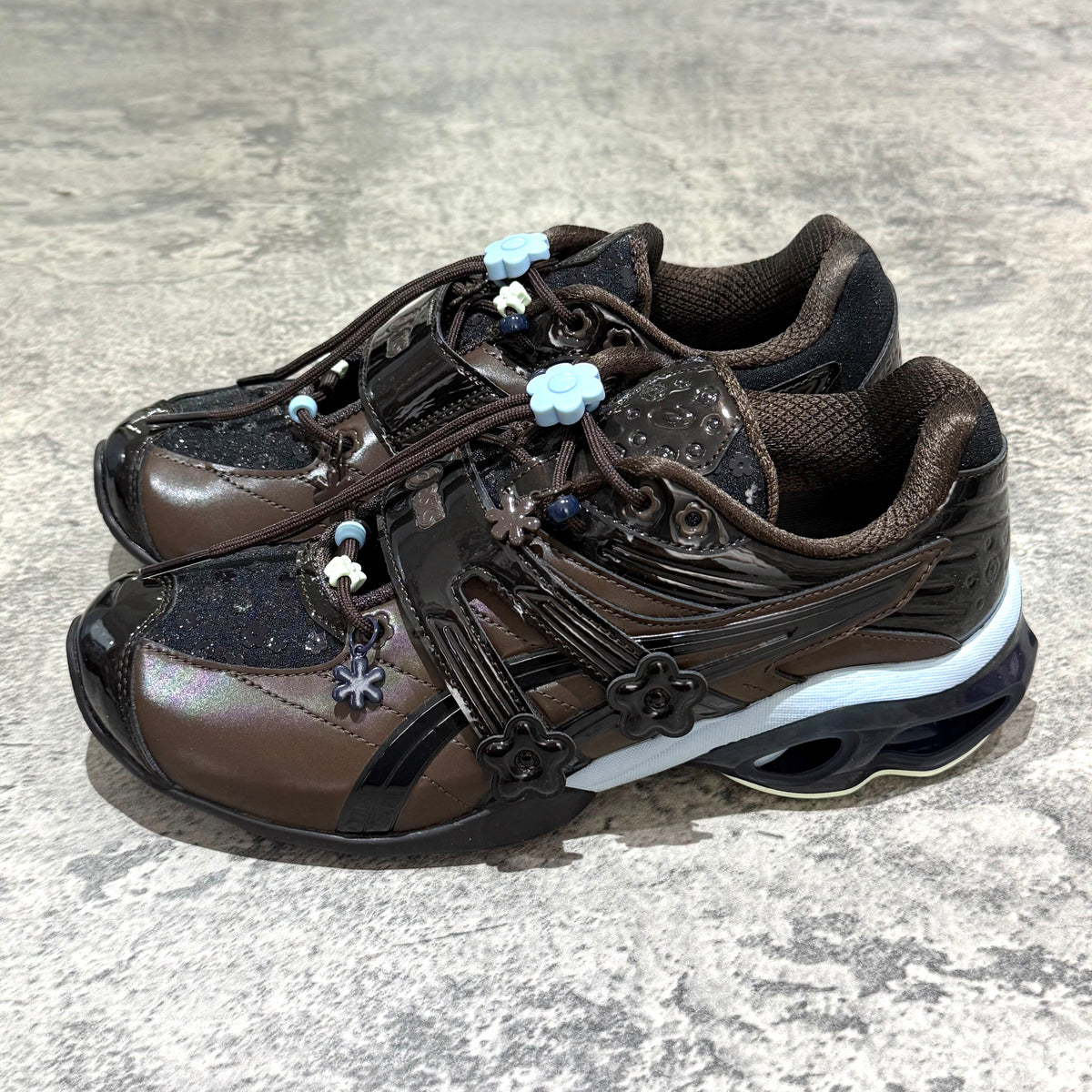 Cecilie Bahnsen x Asics Gel-Kinetic FR - Black Coffee 1203B171-001 stylish sneakers featuring unique floral details.