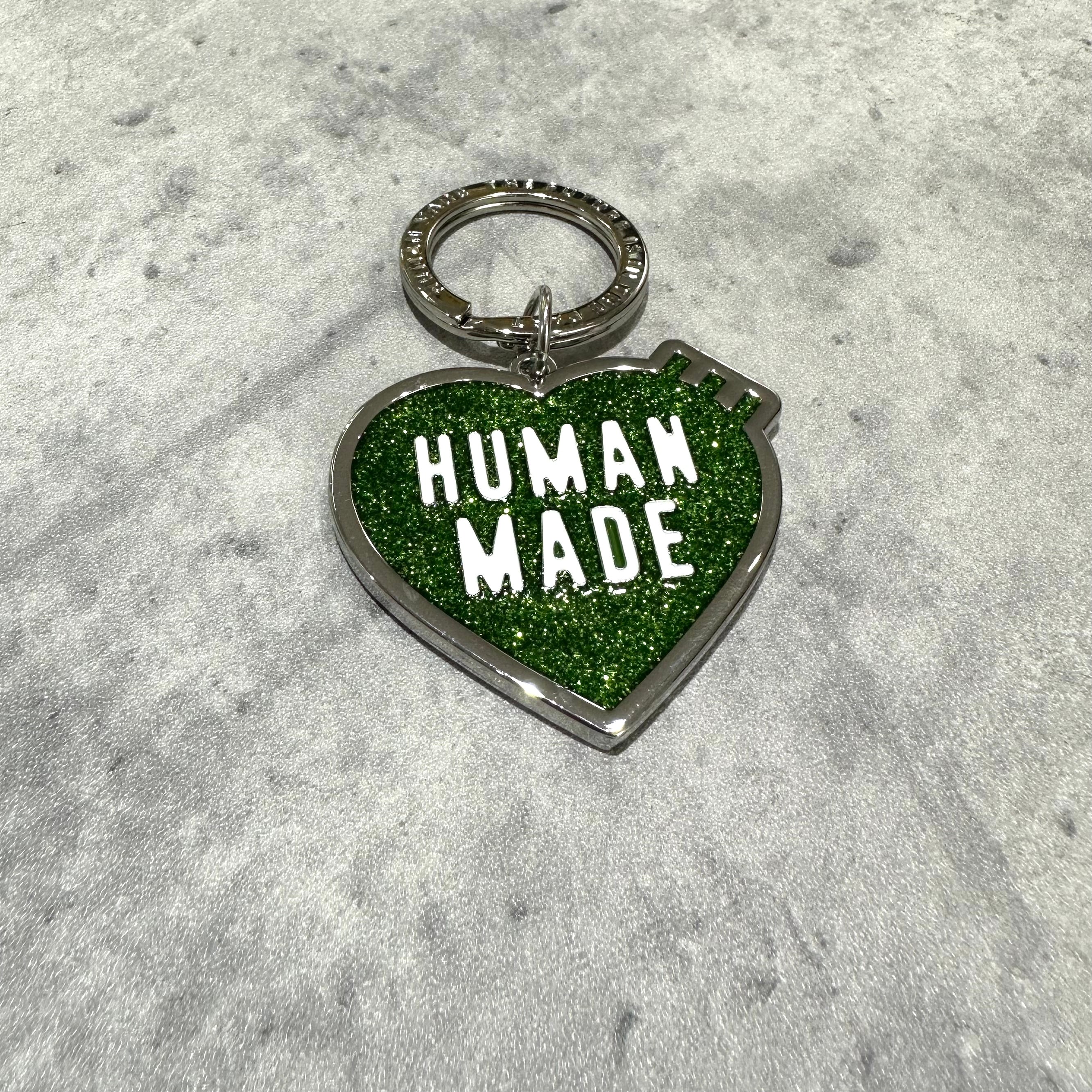 Human Made Store Exclusive Heart Keychain with green glitter finish and bold lettering.