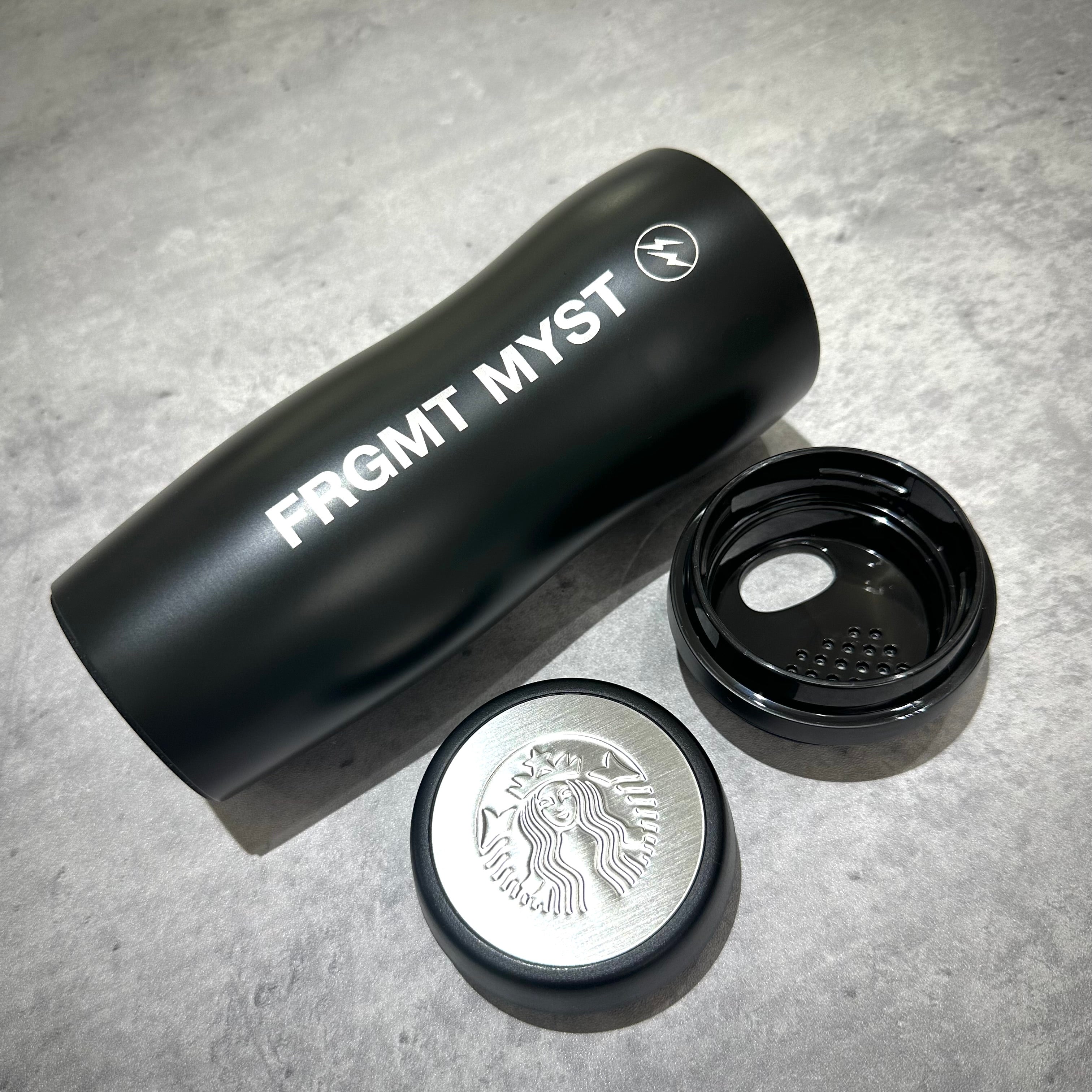 FRGMT MYST x STARBUCKS Curved Stainless Bottle with lid removed, showing stylish black design and logo.