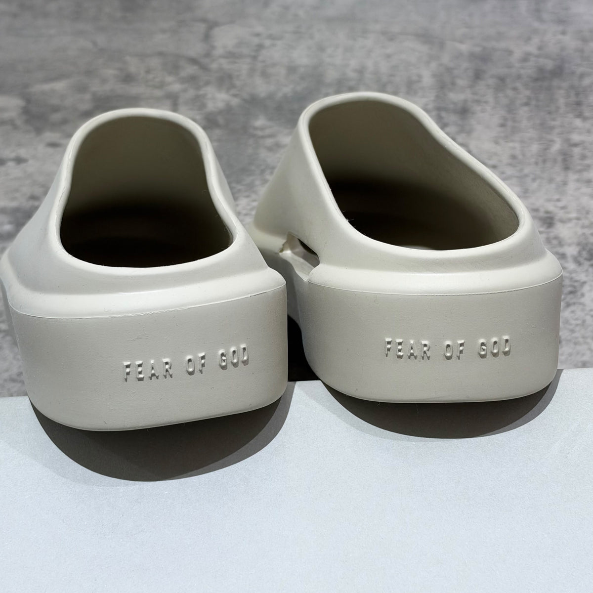 Fear of God The California Slip-on Oat FG80-100EVA rear view showcasing minimalist design and embossed branding.