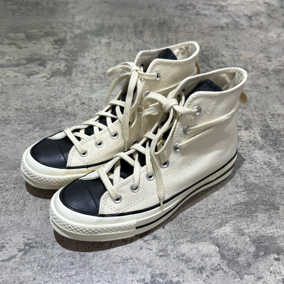 Fear Of God Essentials x Converse Chuck 70s Hi - White / Grey high-top sneakers with black toe cap.