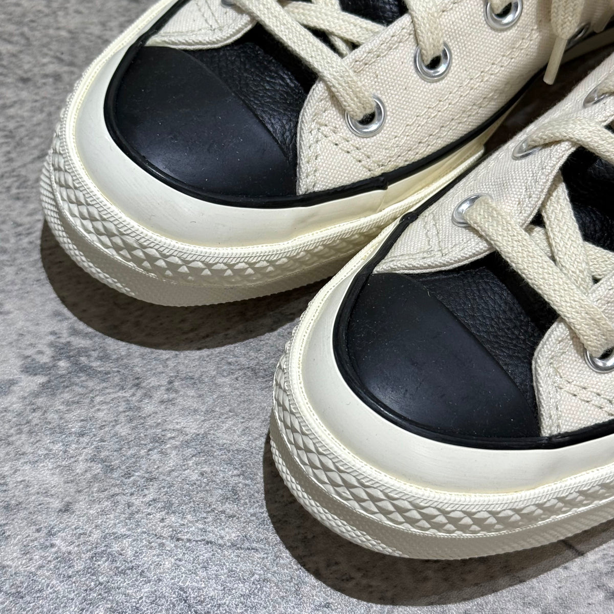 Fear Of God Essentials x Converse Chuck 70s Hi - White / Grey close-up view showing the sneaker's toe and lace details.