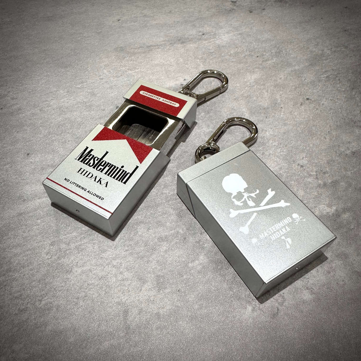 HIDAKA x mastermind JAPAN Portable Ashtray in red and silver featuring Mastermind World x Doctor Air design.