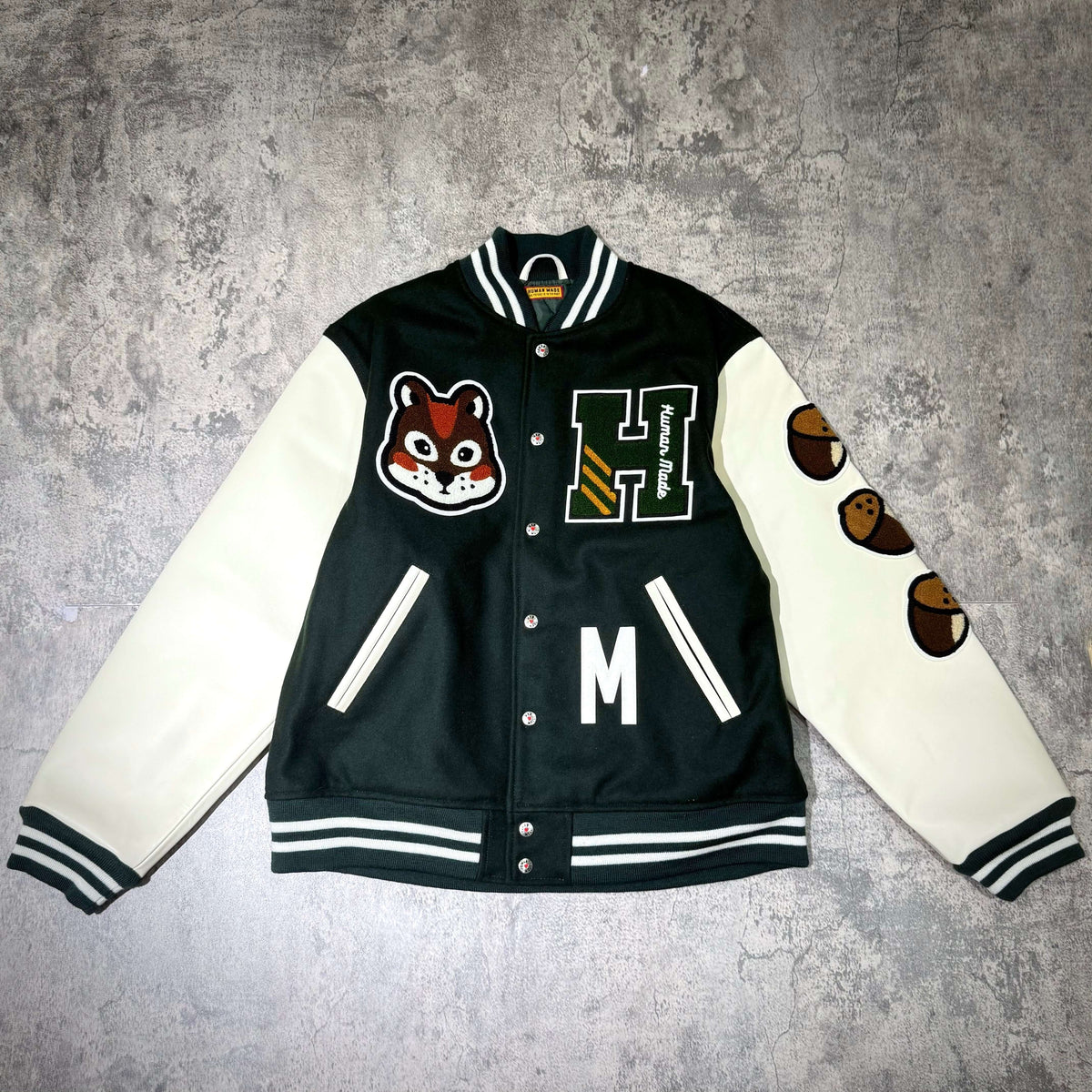 HUMAN HOPE Varsity Jacket HUMAN MADE x j-hope of BTS featuring unique graphics and design elements.