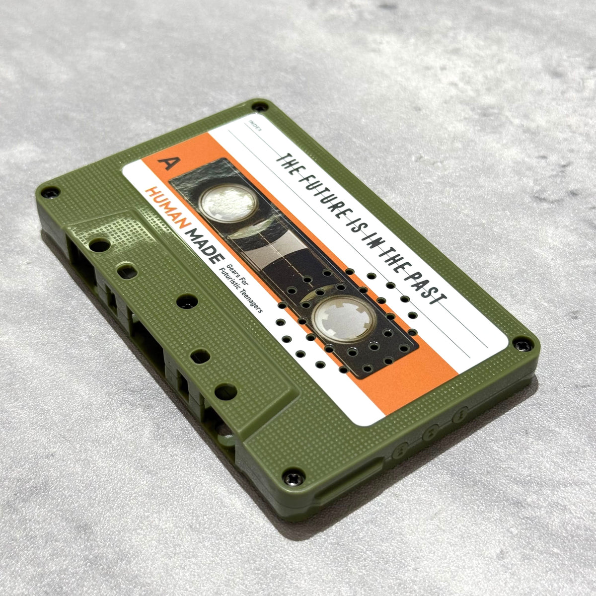 Human Made Cassette Speaker featuring retro design with orange and green casing.