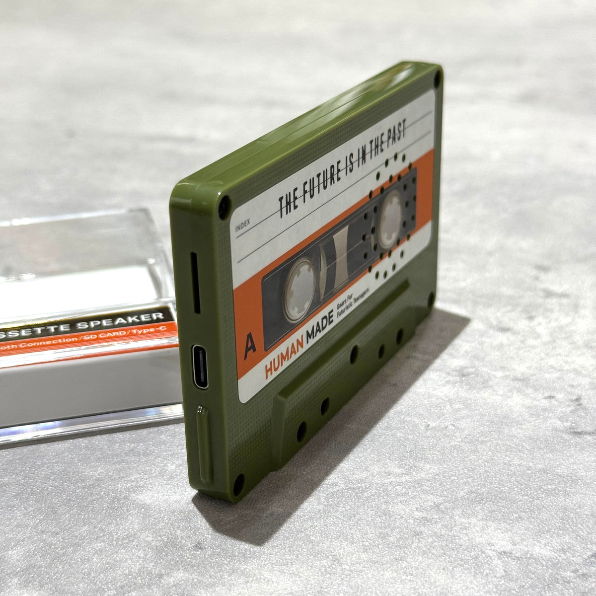 Human Made Cassette Speaker showcasing retro design and modern features with a green casing and vintage audio style.