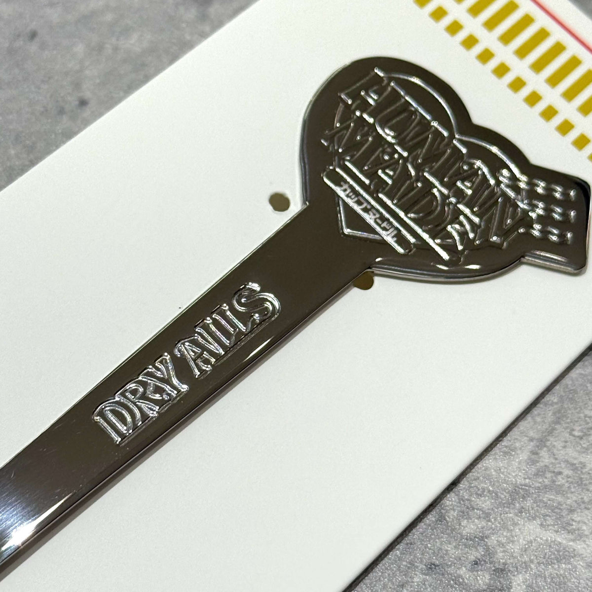Human Made Cup Noodle Fork with a shiny silver finish, featuring the engraved logo and the word 'DRY NAILS'.