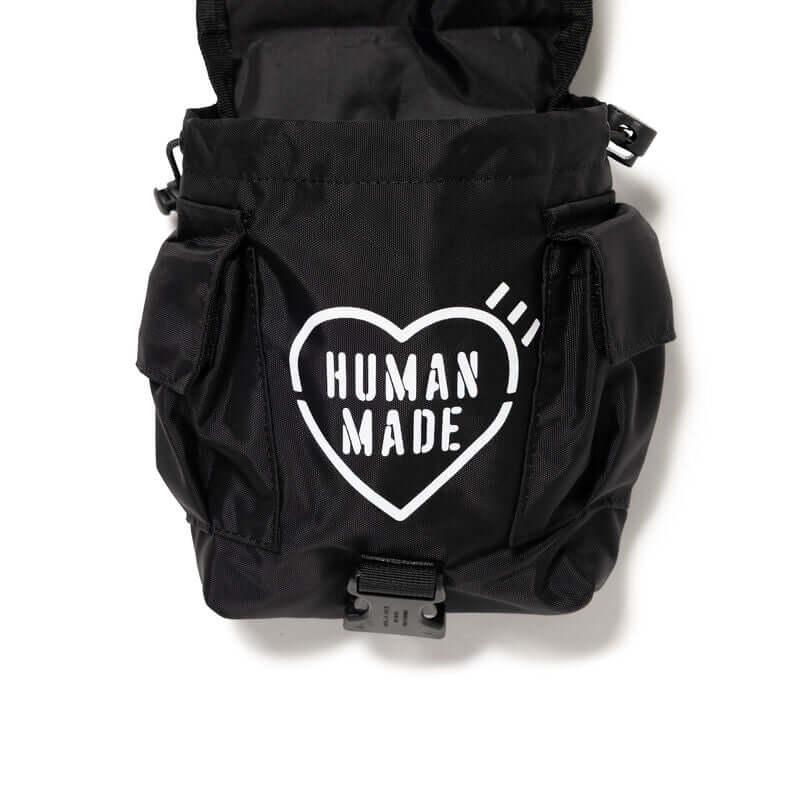 Human Made Military Multi Pouch with heart logo on black fabric background.