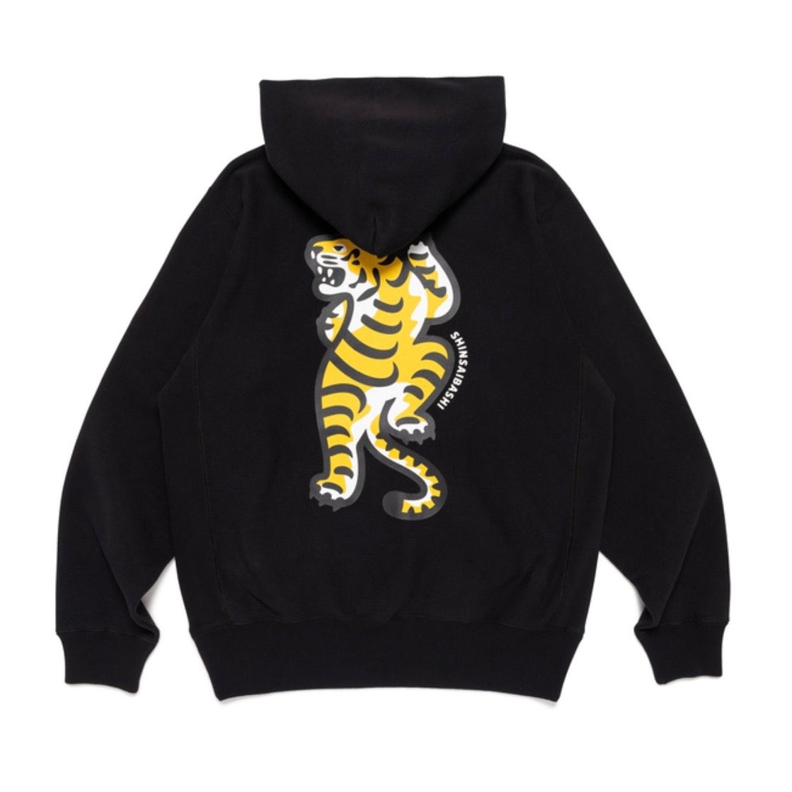 Human Made Shinsaibashi Exclusive Tiger Heavyweight Hoodie featuring a vibrant tiger graphic on a black background.