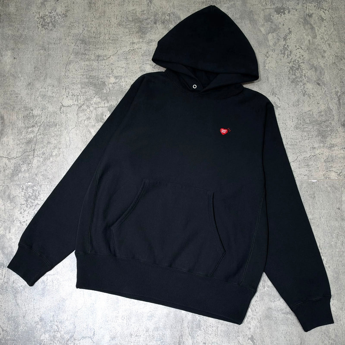 Human Made Shinsaibashi Exclusive Tiger Heavyweight Hoodie in black with a red logo on the chest.