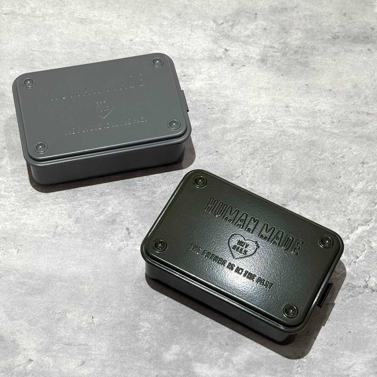 Human Made Steel Tool Box in green and gray colors, showcasing vintage industrial design and practical utility.