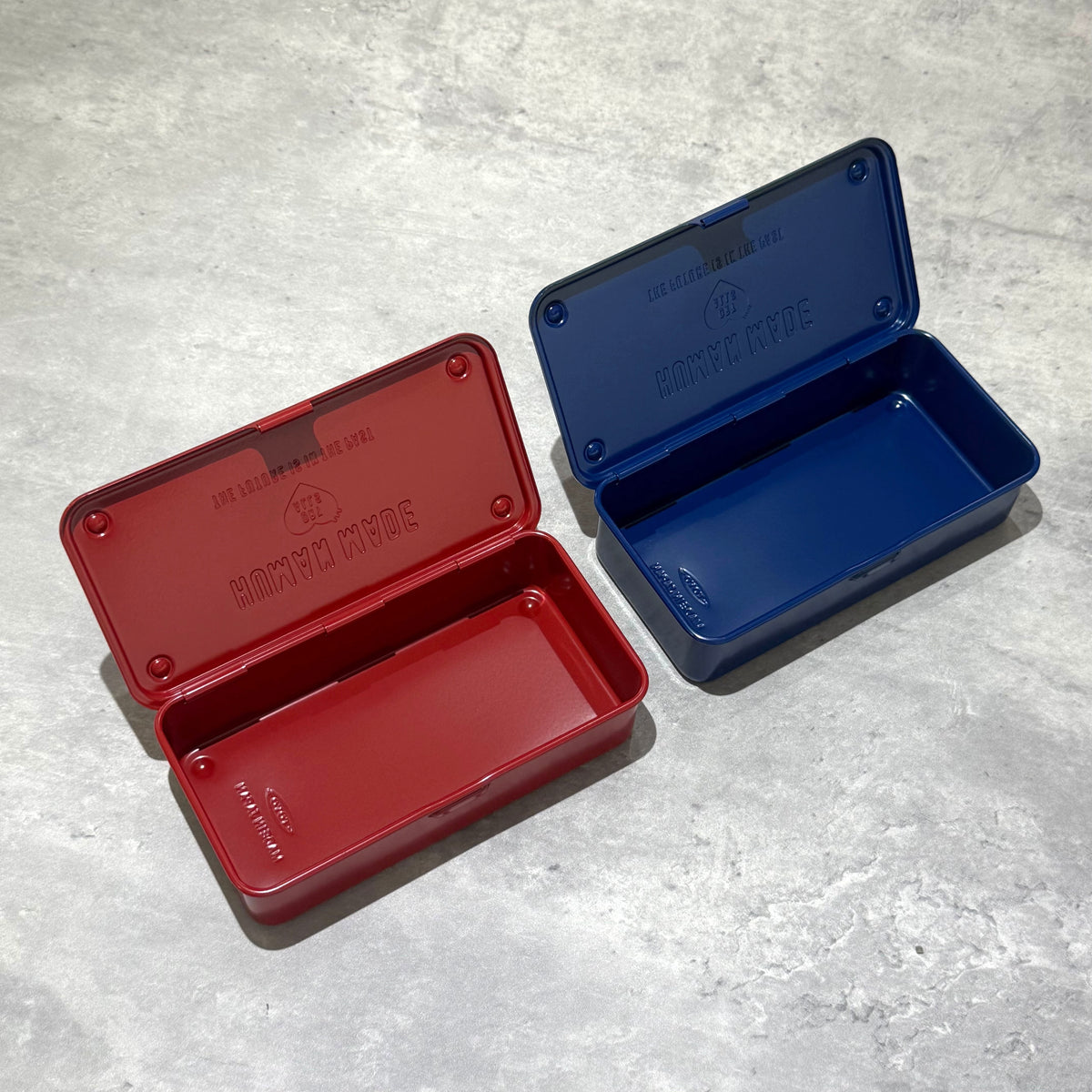 Human Made Steel Tool Box in red and blue, showcasing a vintage industrial design with practical utility.