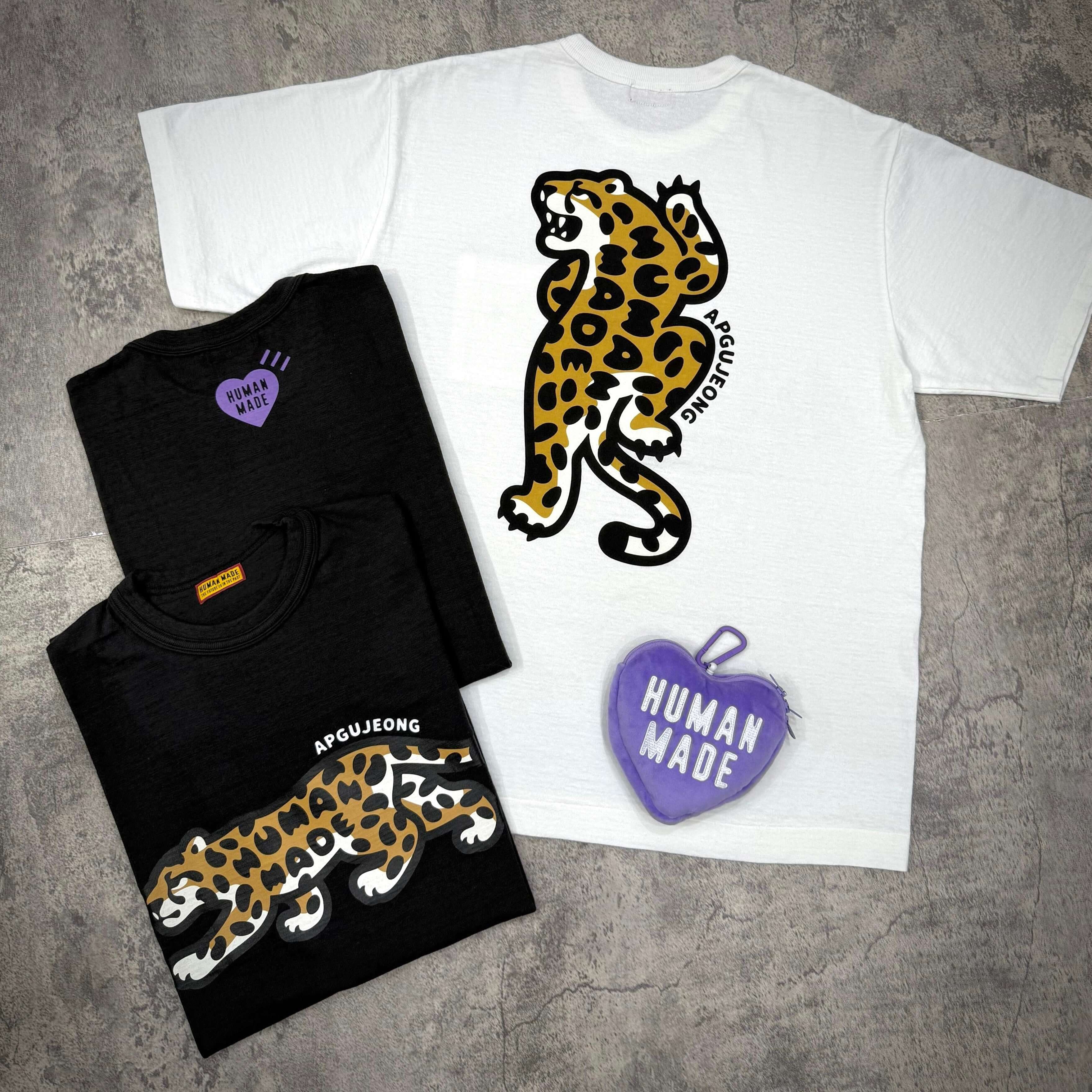 Two Human Made Apgujeong graphic tees featuring leopard prints and a purple heart accessory.