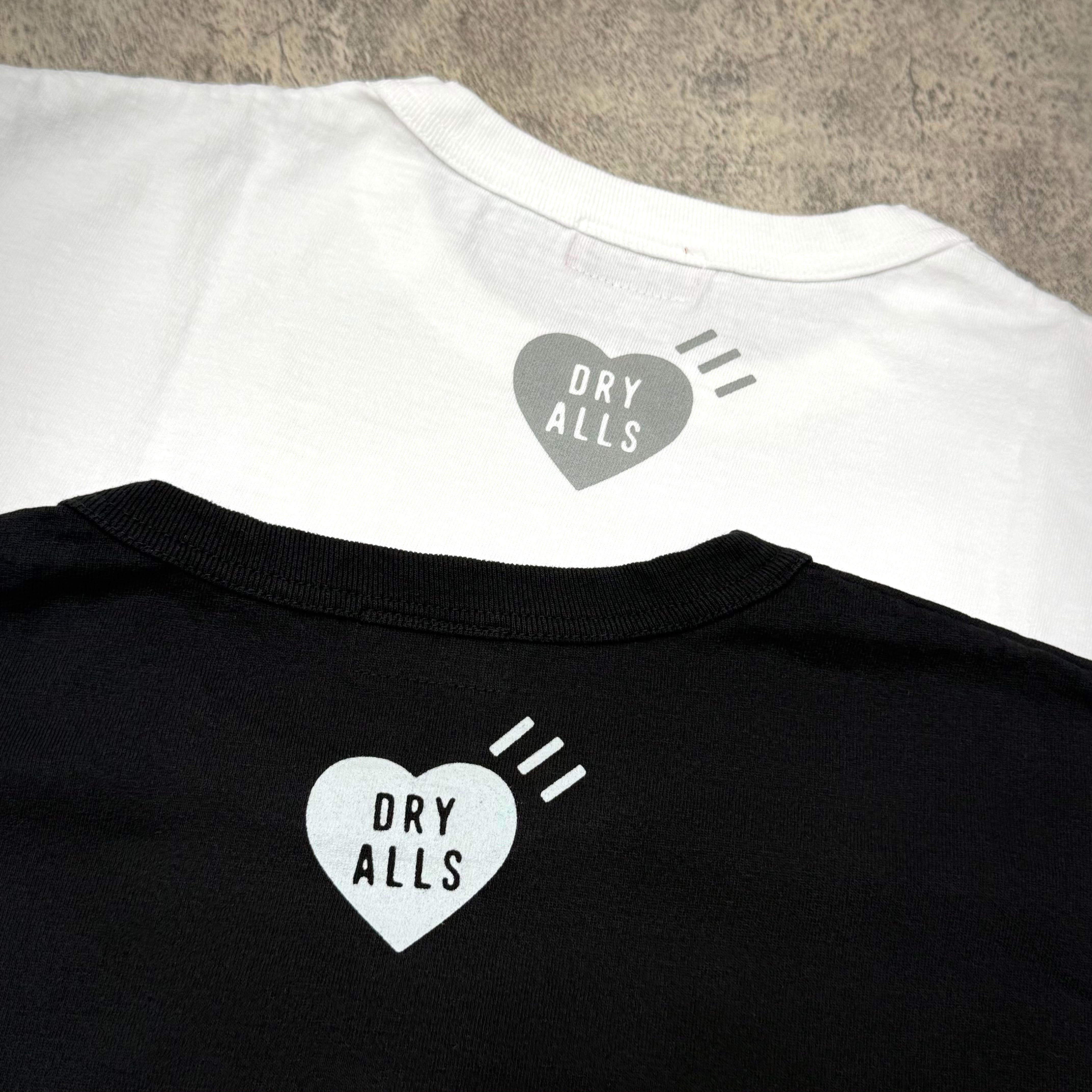 Human Made Sapporo Exclusive Heart Logo Tee displayed in black and white, showcasing heart logo detail on the back.