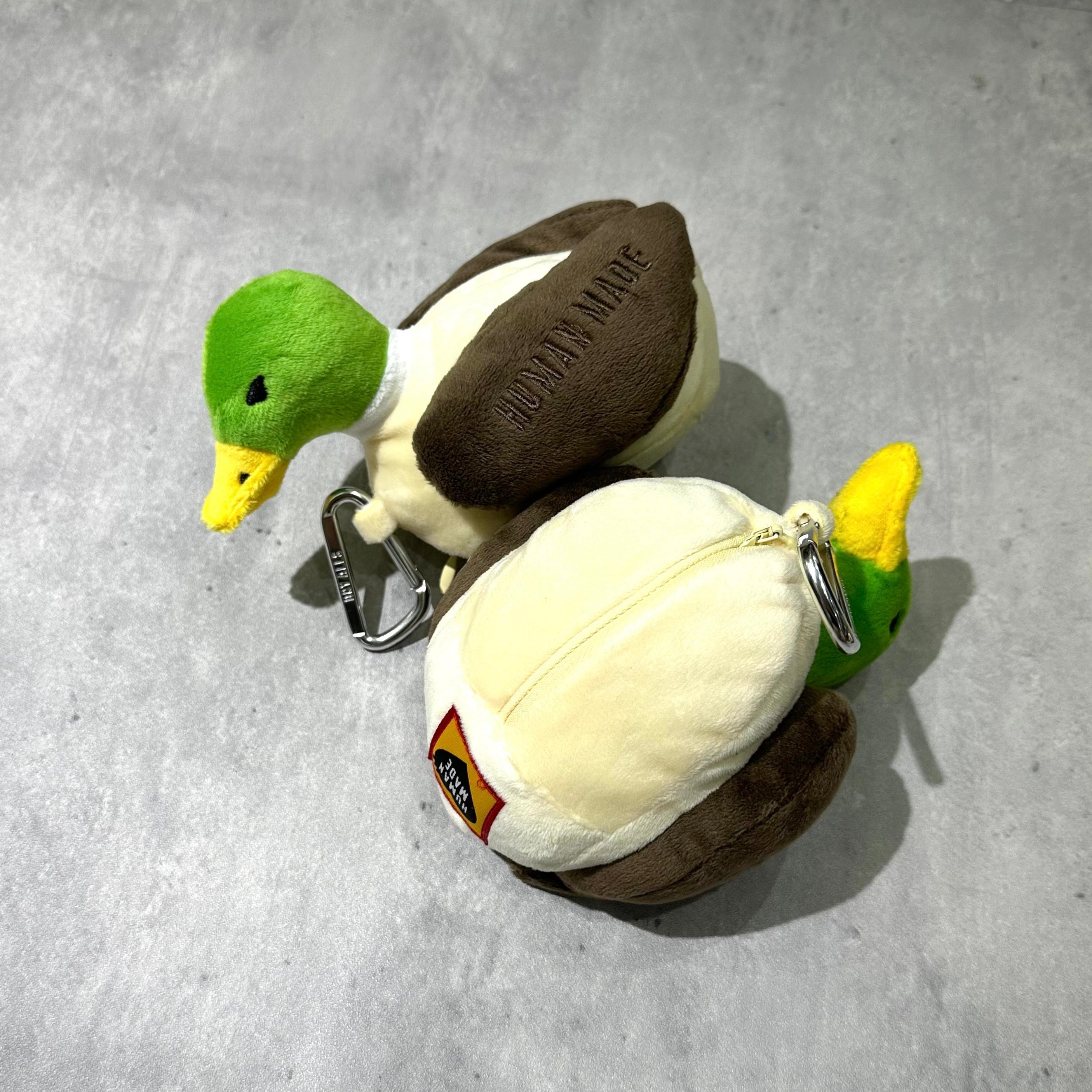Human Made Duck Plush Pouch featuring vibrant green and brown colors, perfect for storing small items.