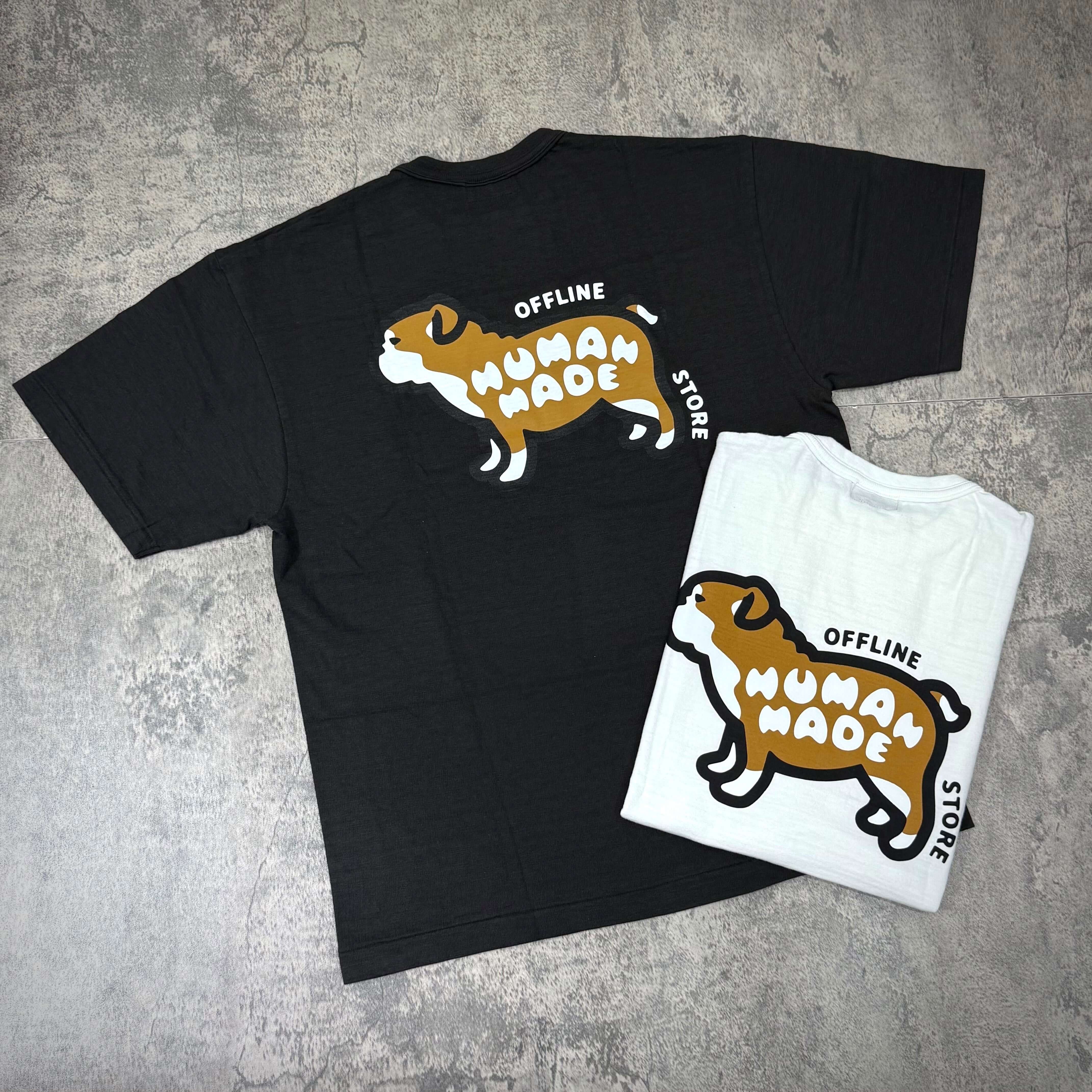 Human Made Gaien offline Exclusive Bull Dog Back Logo Tee displayed in black and white colors on a textured background.