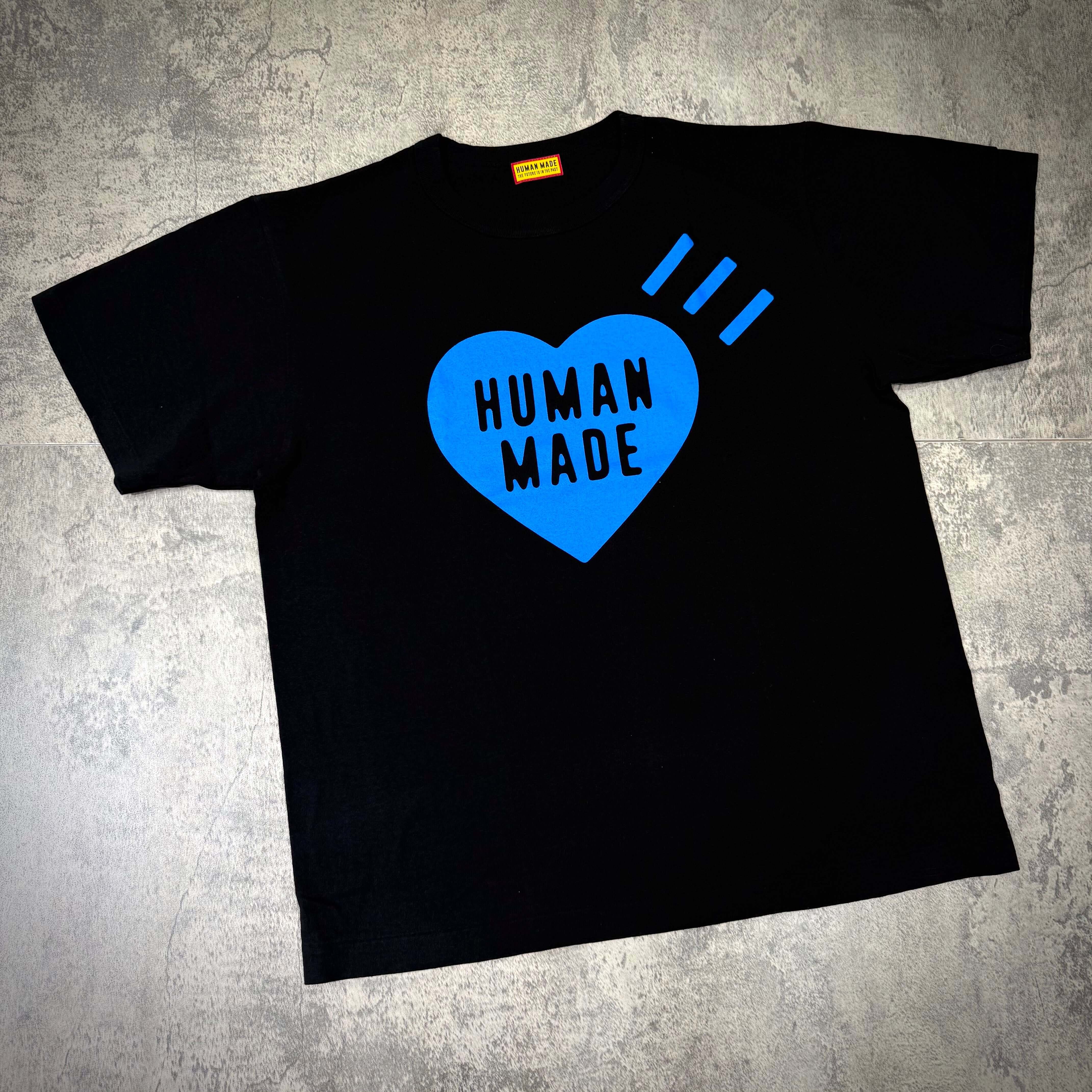 Human Made Gaien offline Exclusive Heart Logo Tee with blue heart and text on black background.