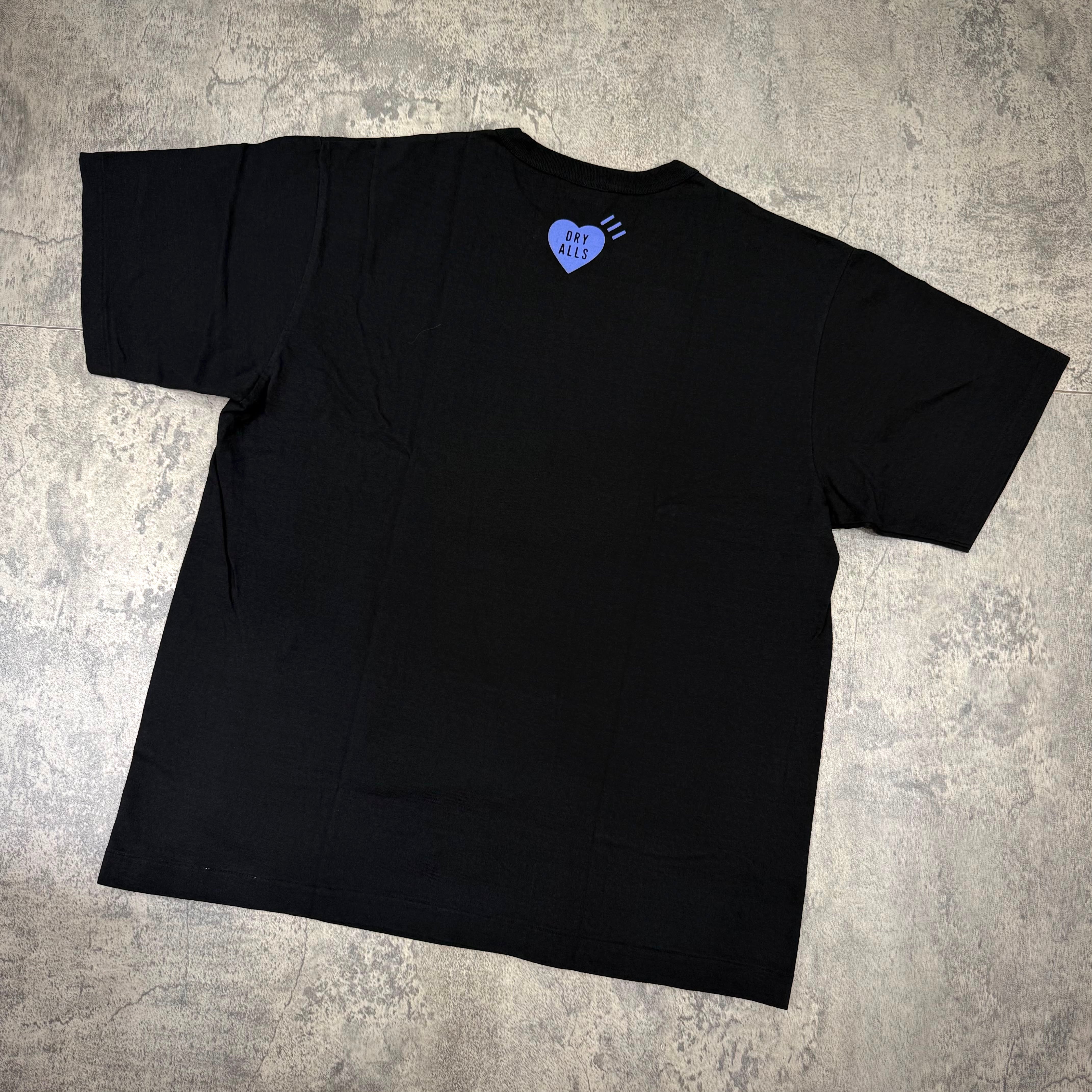 Human Made Jamsil Exclusive Heart Logo Tee featuring a heart logo on the back of a black t-shirt.