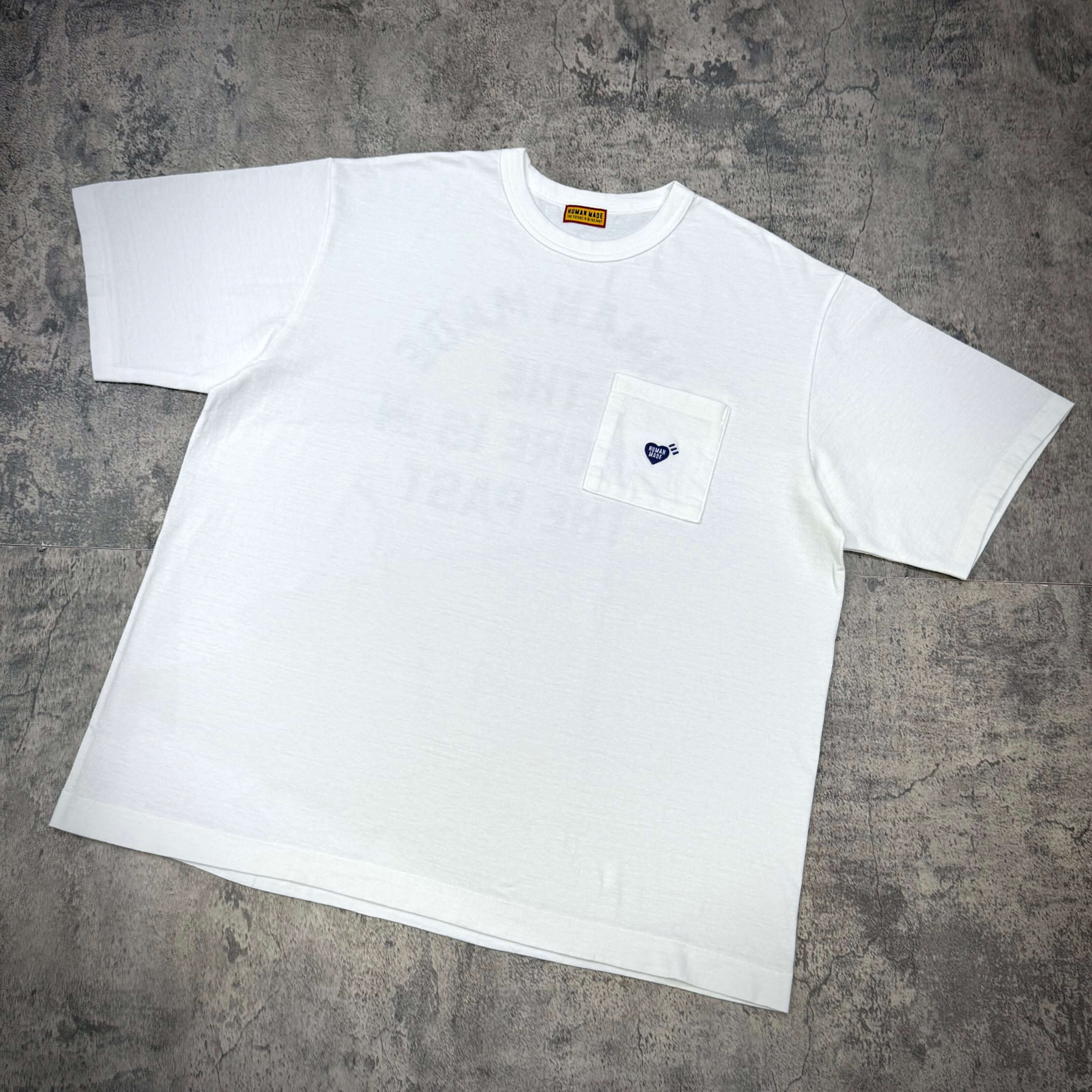 Human Made Jamsil Exclusive Heart Pocket Tee displayed on a grey textured background.