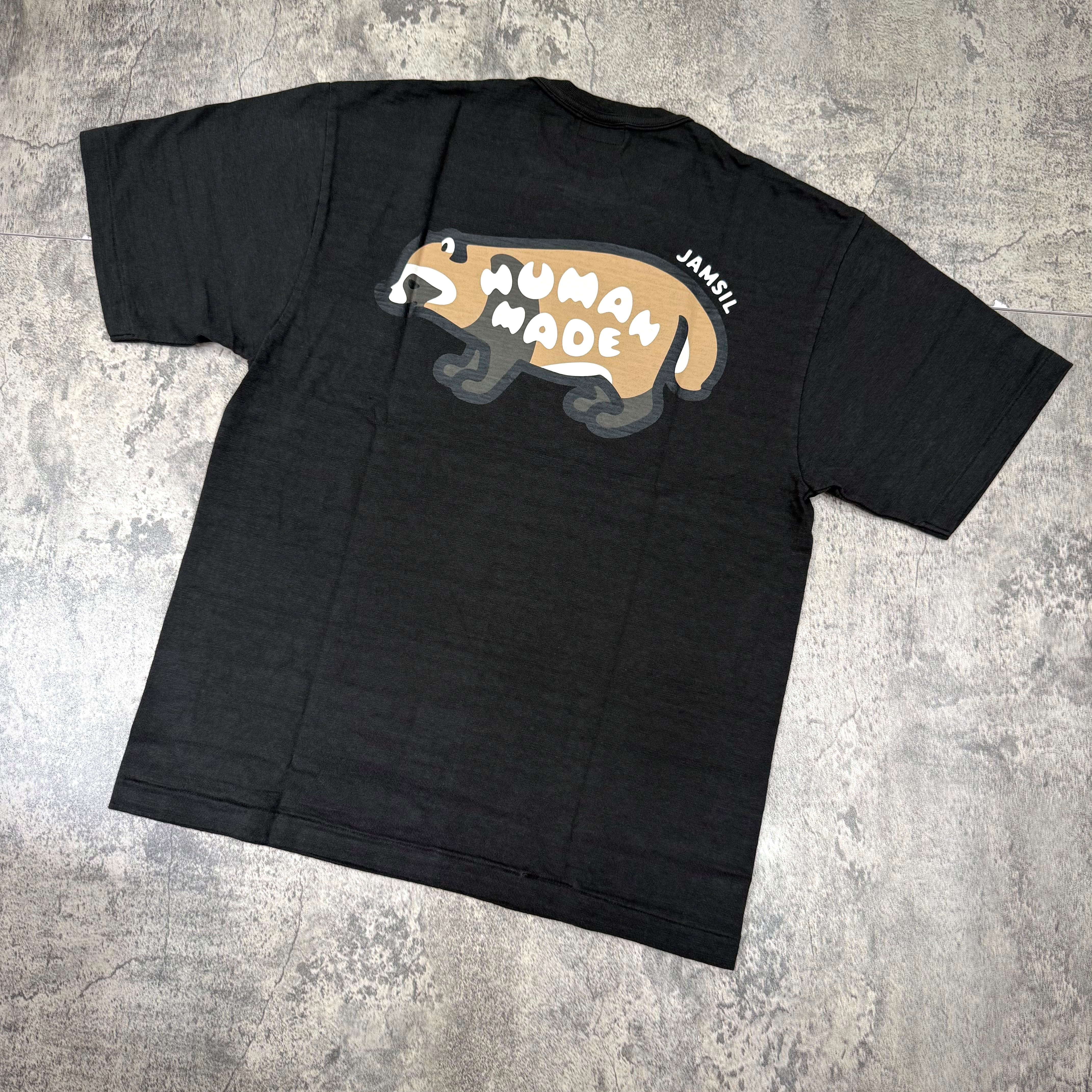 Human Made Jamsil Exclusive Raccon Back Logo Tee featuring a raccoon graphic on a black t-shirt.