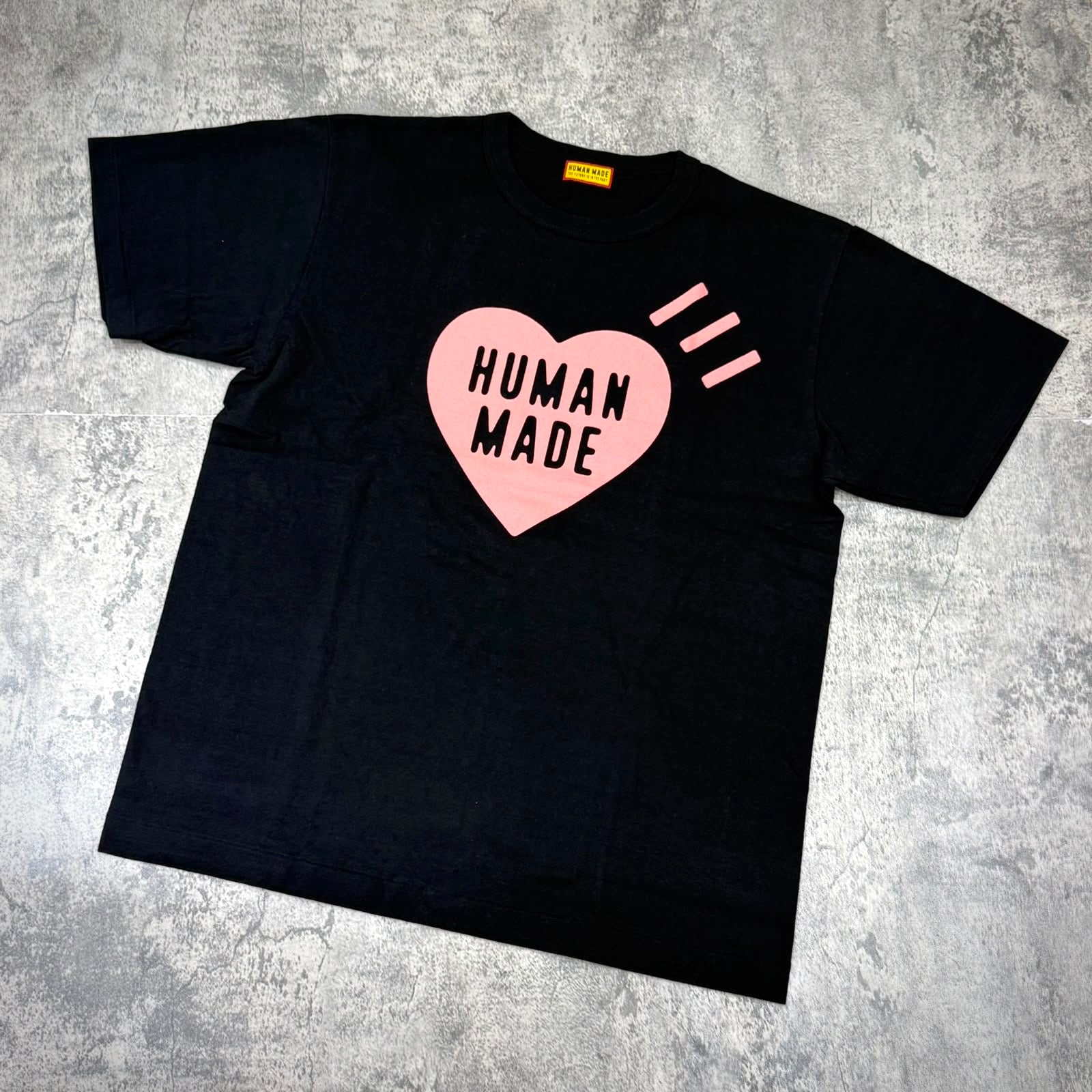 Human Made Seoul Exclusive Heart Logo Tee with pink heart design on black t-shirt