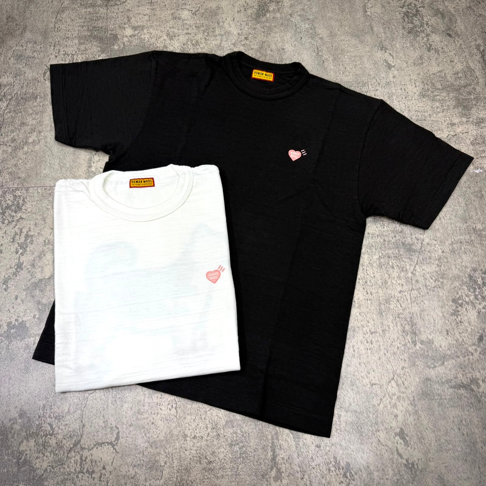 Human Made Seoul Exclusive Jindo Dog Back Logo Tee in black and white, featuring heart logo detail.