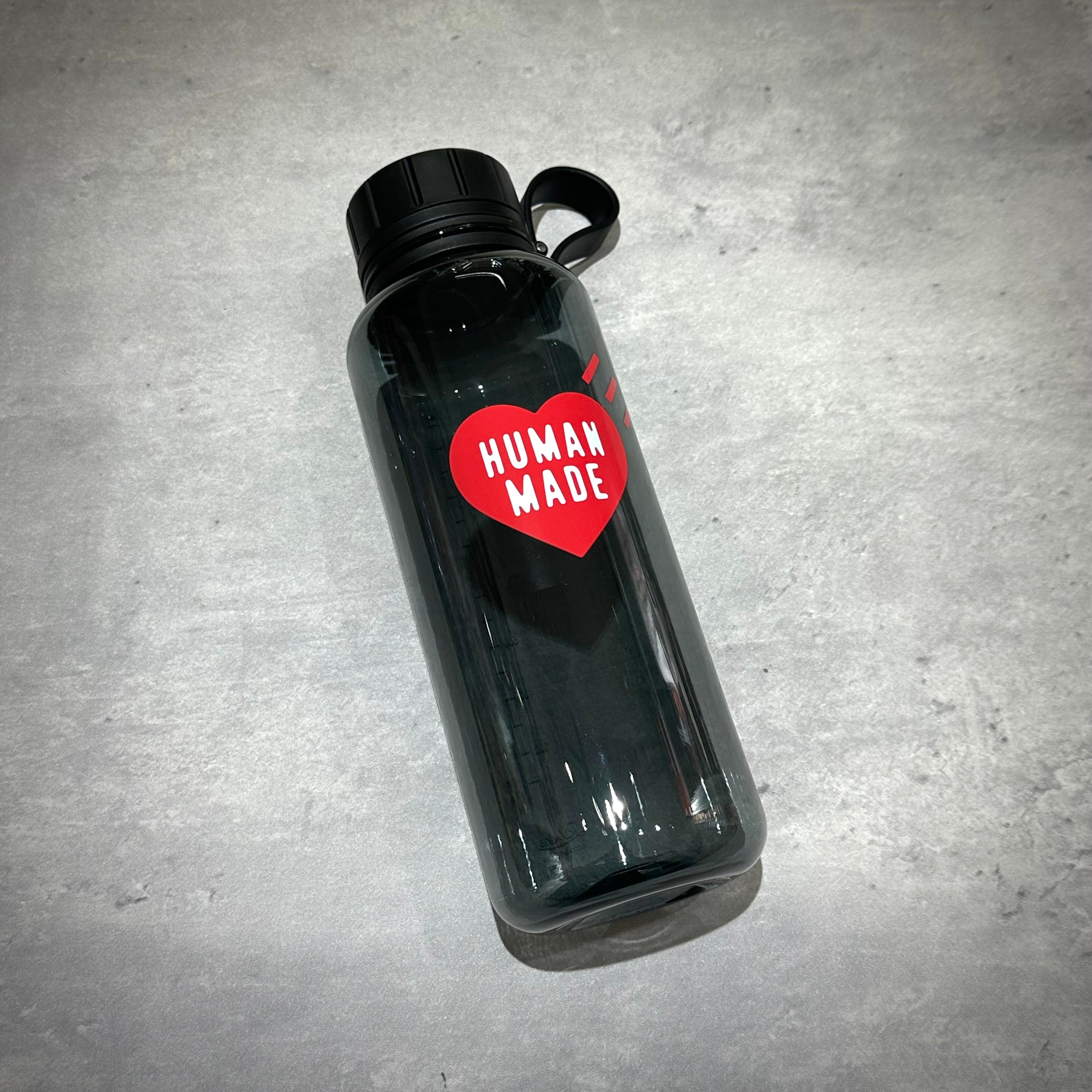 Human Made Water Bottle with a red heart logo on a clear background