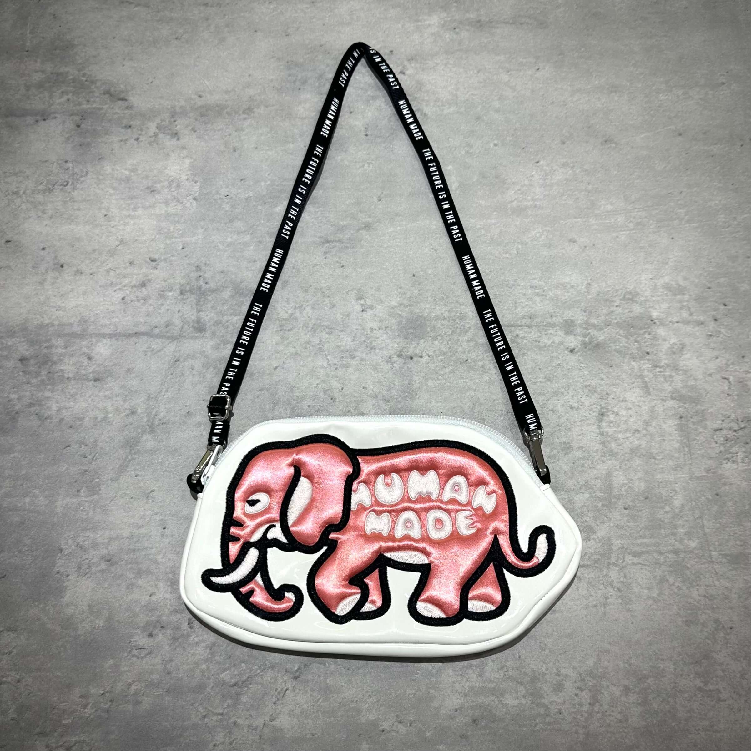 Human Made Bangkok Exclusive Elephant Pouch featuring a pink elephant design with the text 'HUMAN MADE' on a white background.