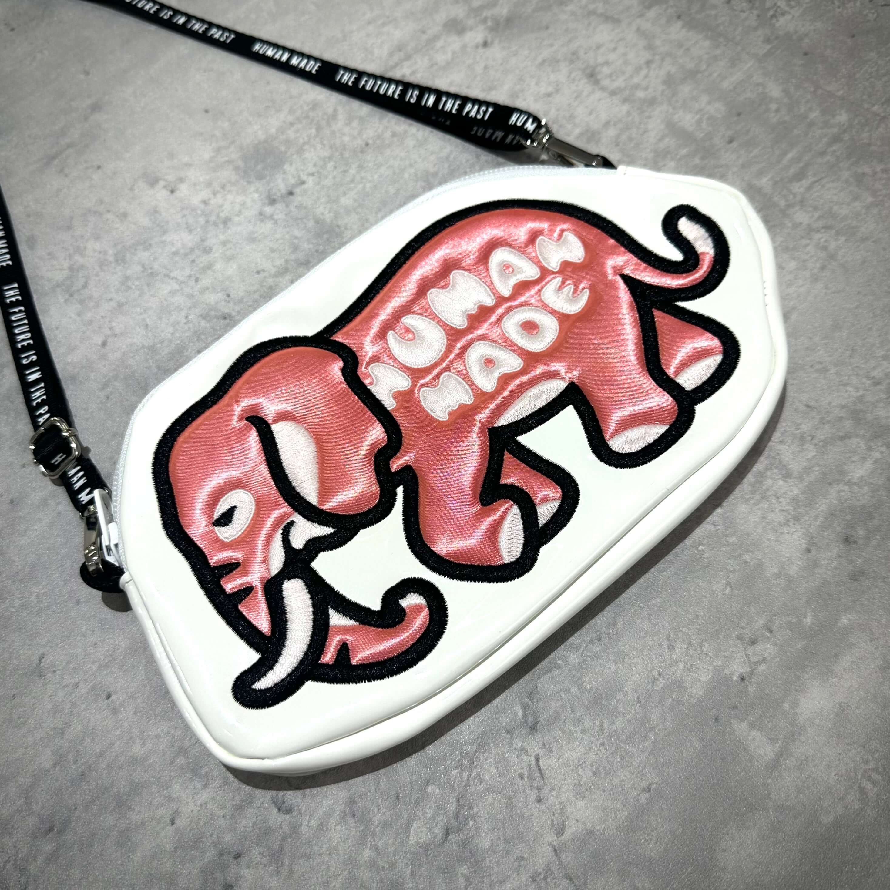 Human Made Bangkok Exclusive Elephant Pouch featuring a pink elephant design on a white background.