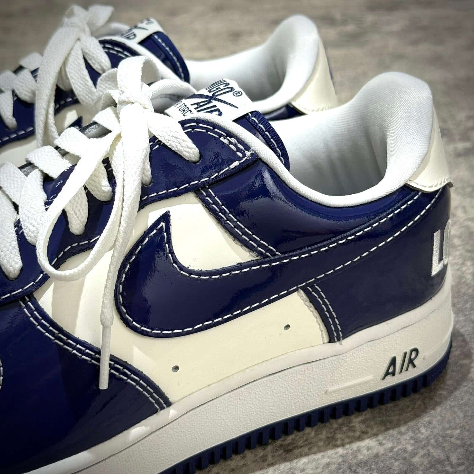 Nigo x Nike Air Force 1 LAST ORGY 2 featuring navy and white colorway, showcasing sleek design and high-quality materials.