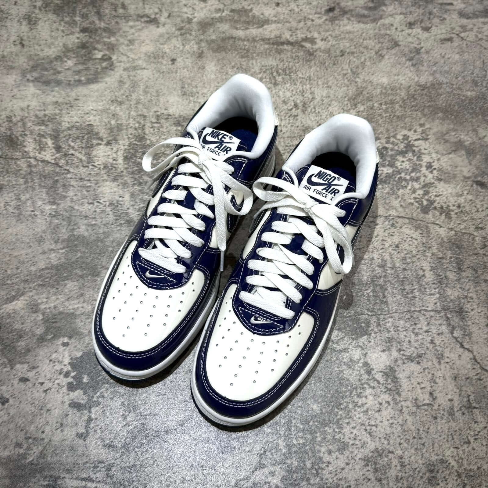 Nigo x Nike Air Force 1 LAST ORGY 2 in white and navy colorway, featuring a classic design and premium materials.