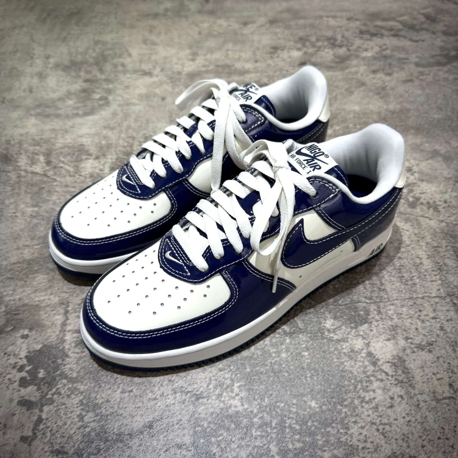 Nigo x Nike Air Force 1 LAST ORGY 2 sneakers in navy and white colorway, featuring classic design and iconic branding.