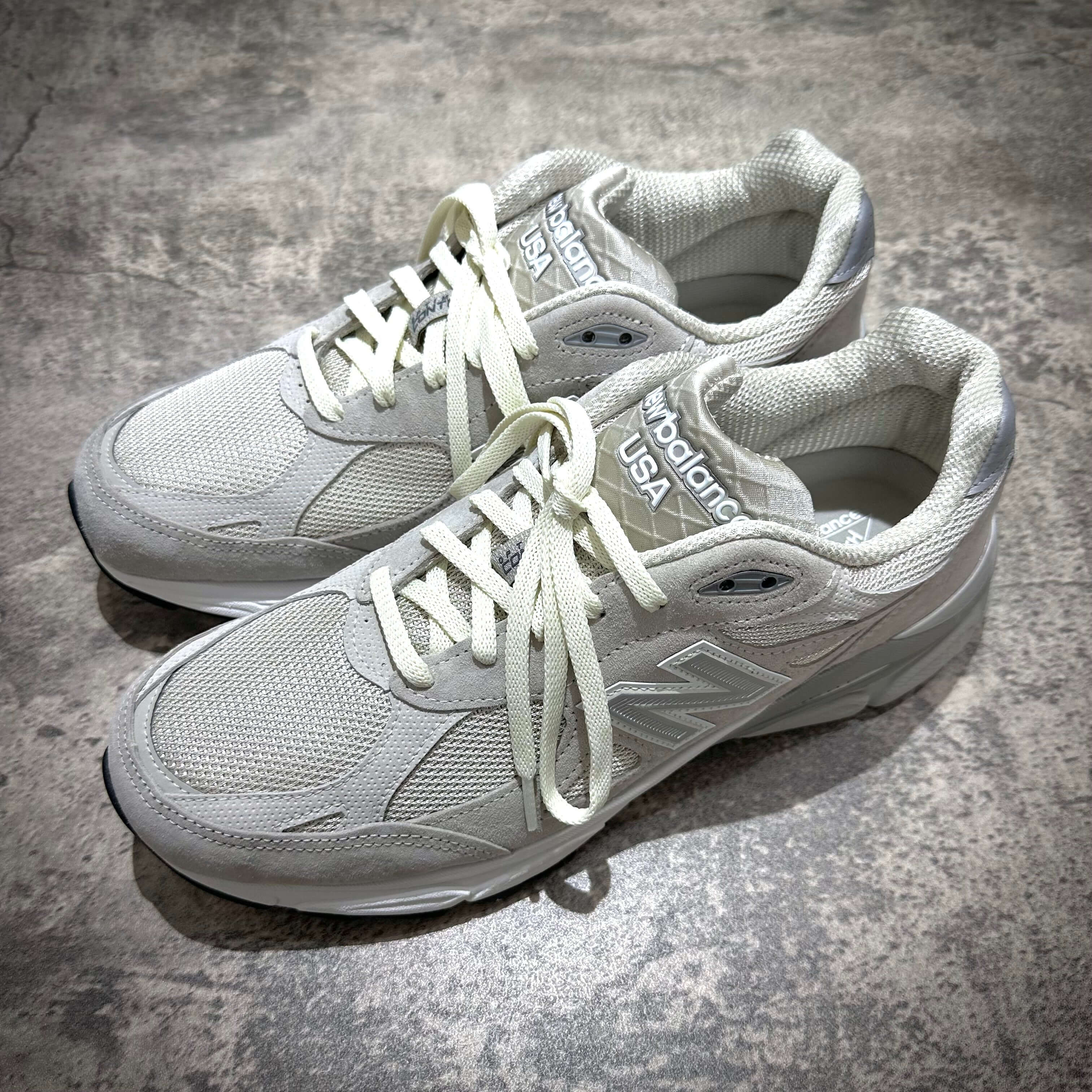 MiUSA Kith x New Balance 990v3 Hallow sneakers in white color with laces visible.