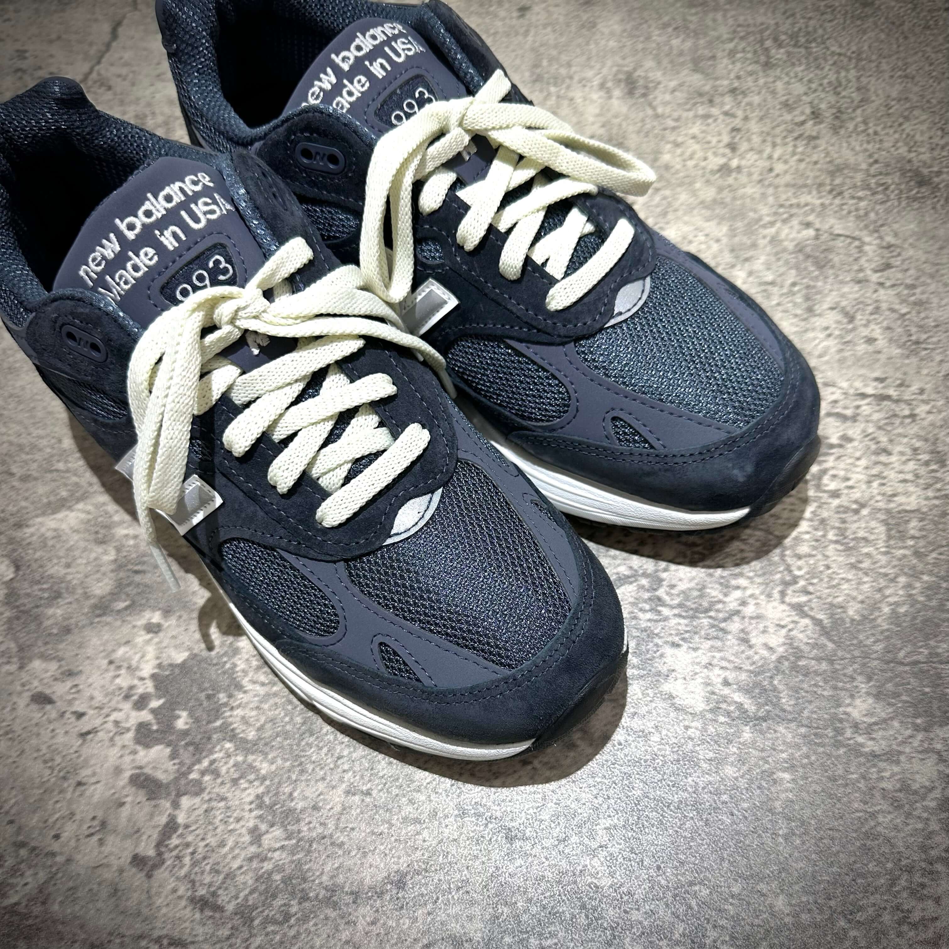 MiUSA Kith x New Balance 993 Asteroid sneakers in dark colorway with white laces, showcasing craftsmanship and style.
