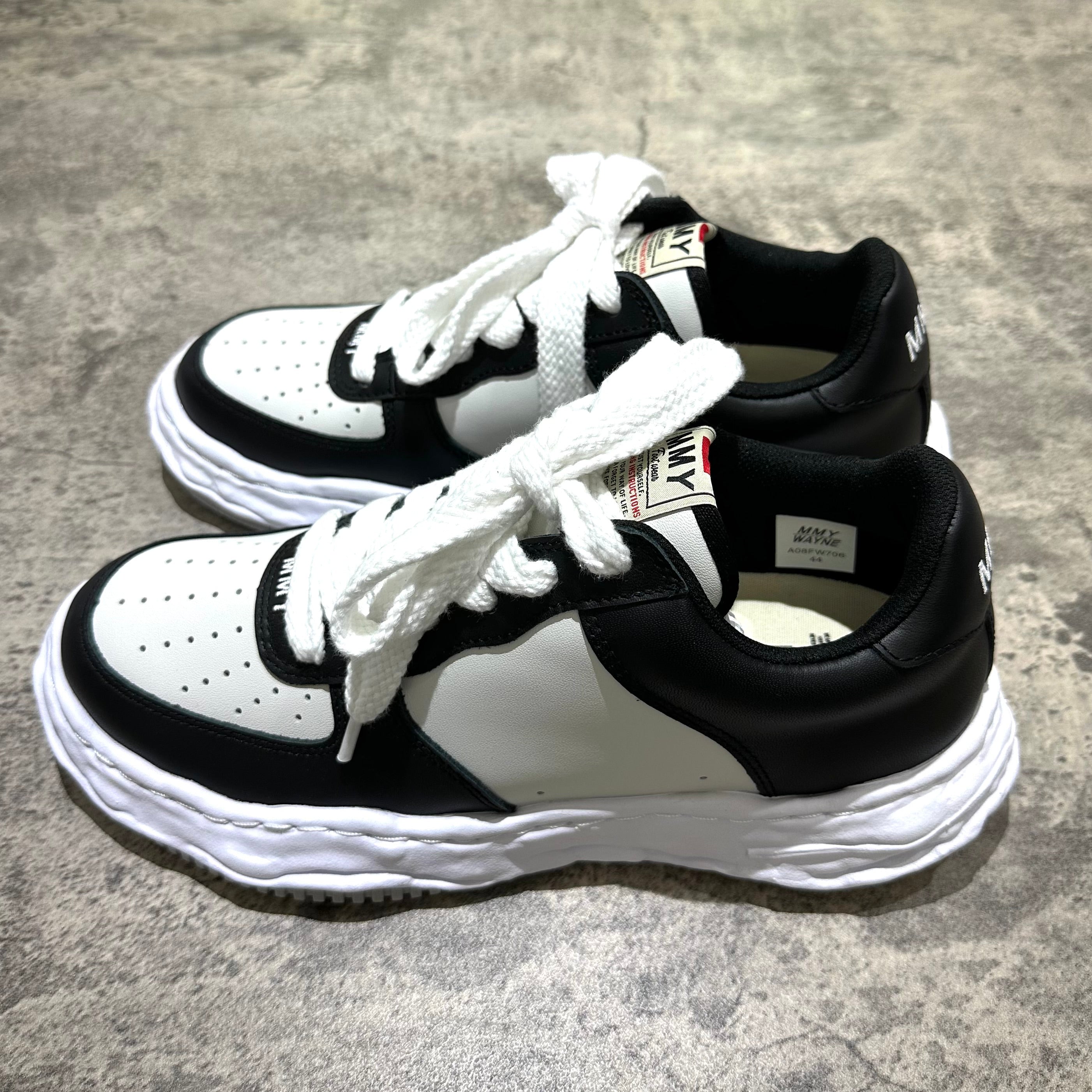 MMY WAYNE OG Leather sneakers in black and white color with white laces and textured sole.