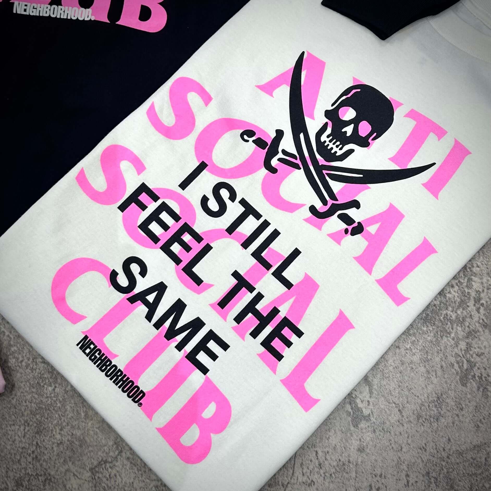 ASSC x Neighborhood Black Jack L/S Tee featuring bold graphic design with pirate skull and text.